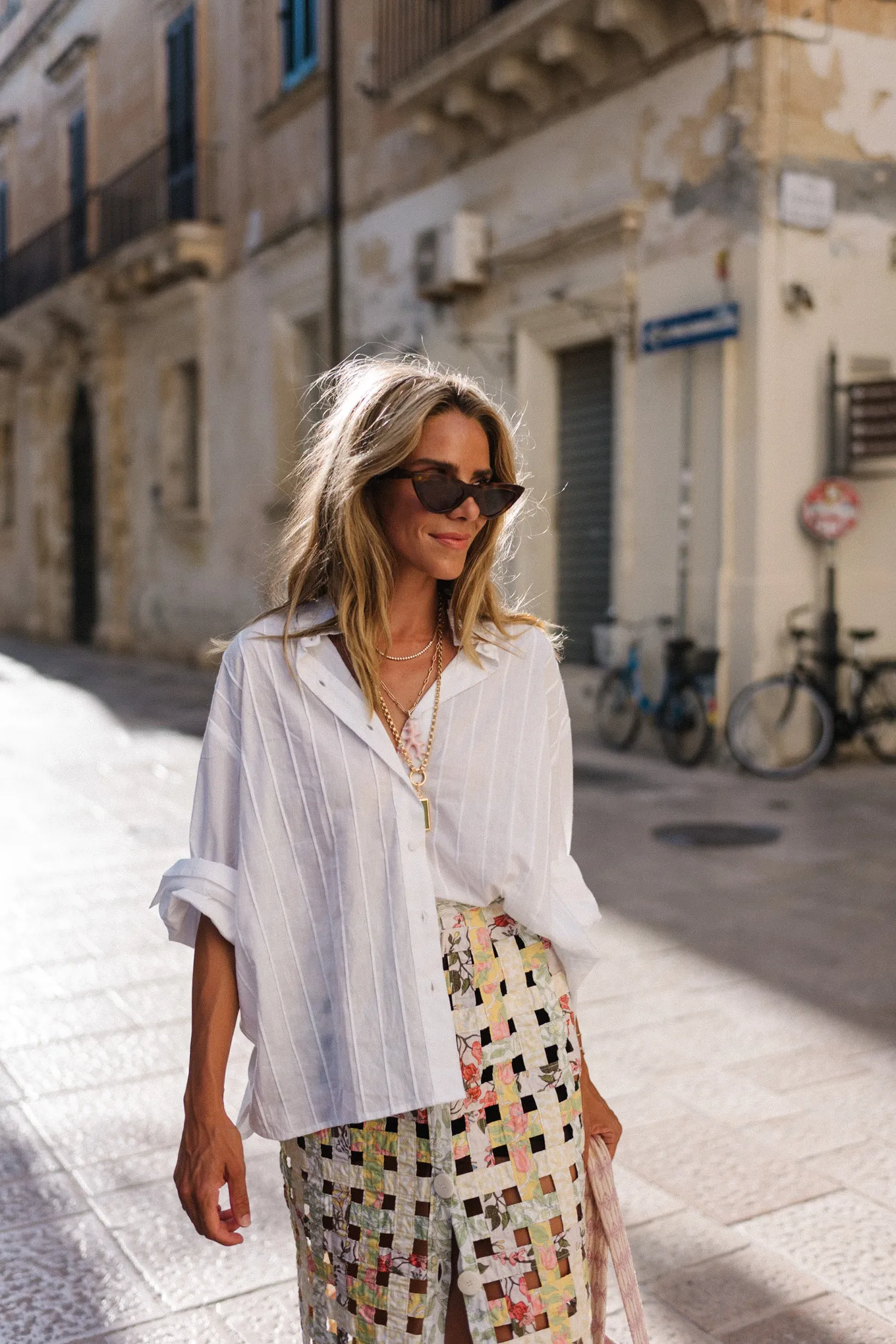 white blouse pastel woven skirt