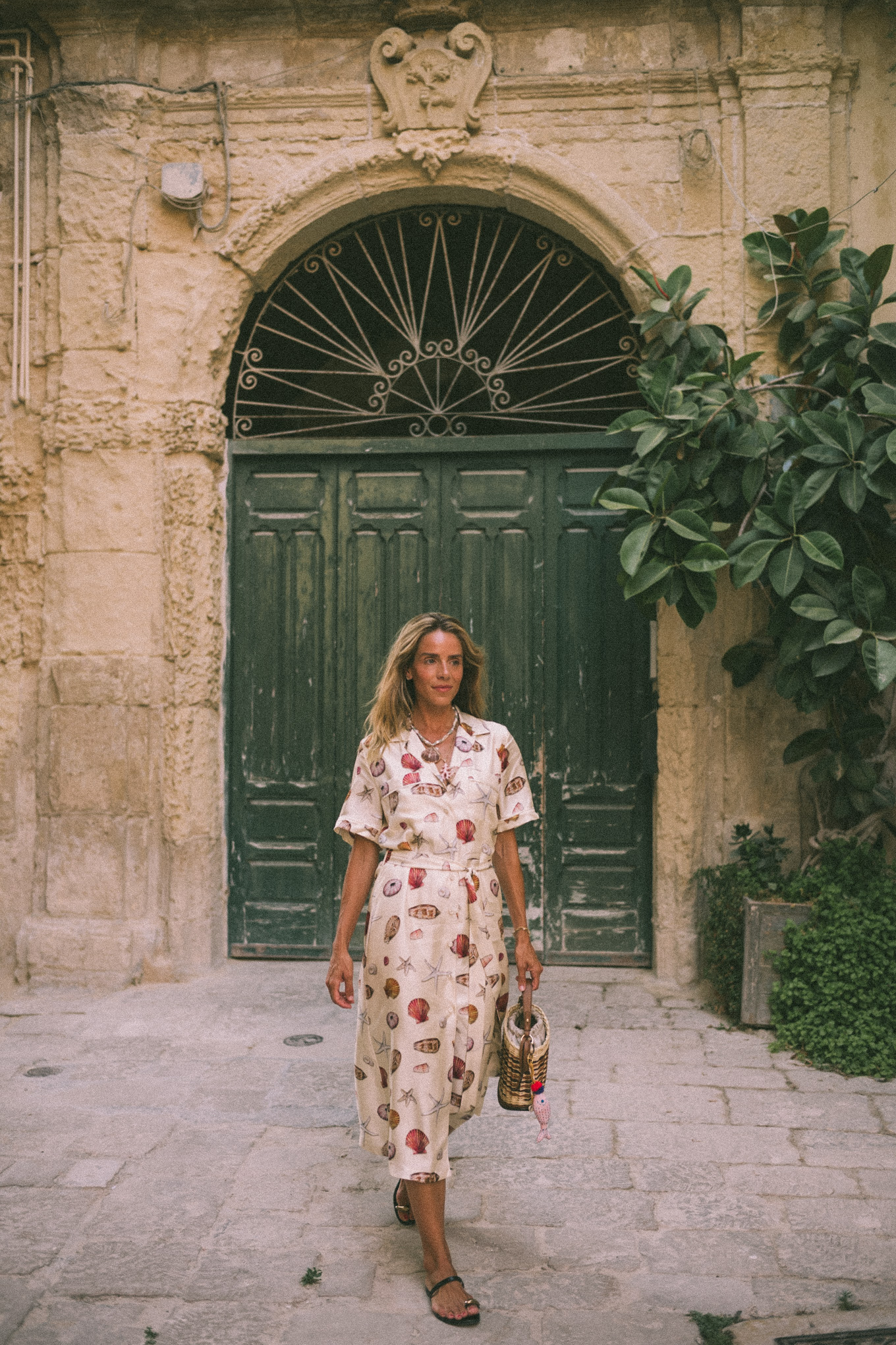 Shell shirt dress Shell necklace Leather sandals Basket bag