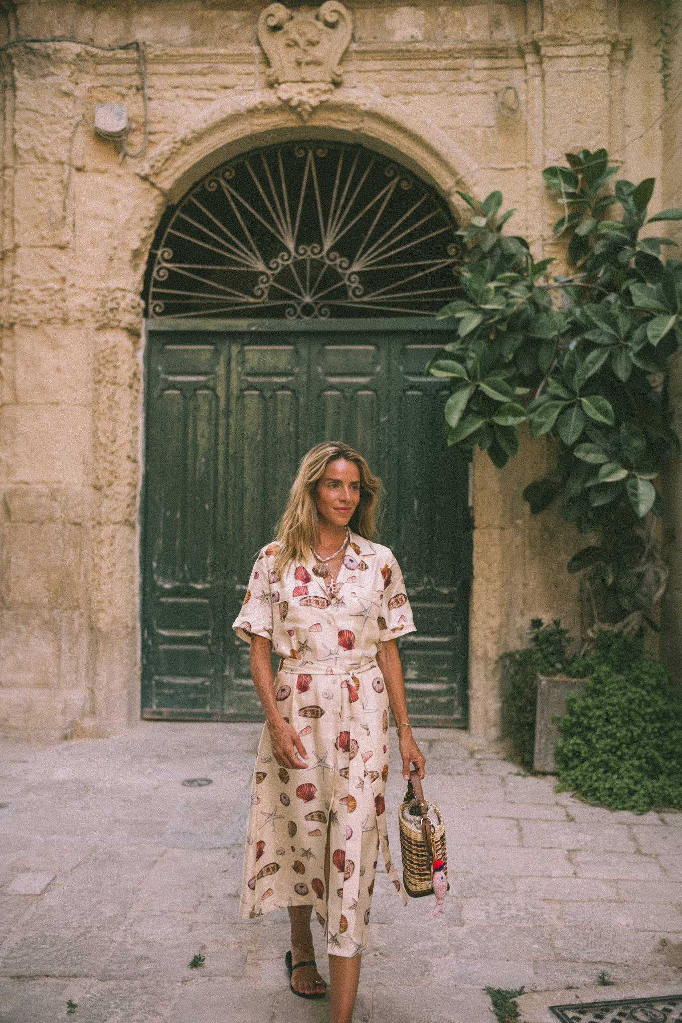 Shell shirt dress Shell necklace Leather sandals Basket bag