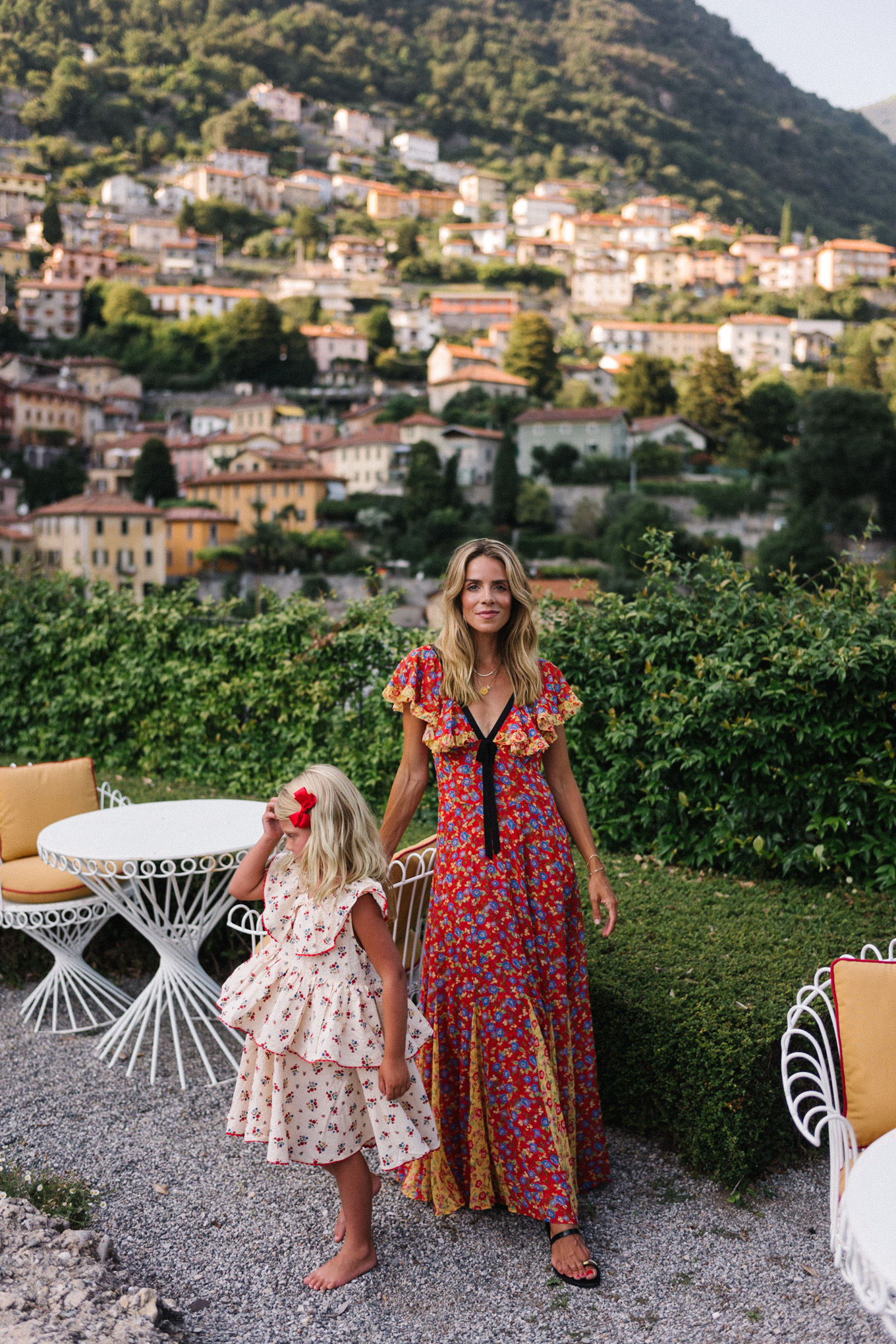 lake como italy red yellow blue floral dress