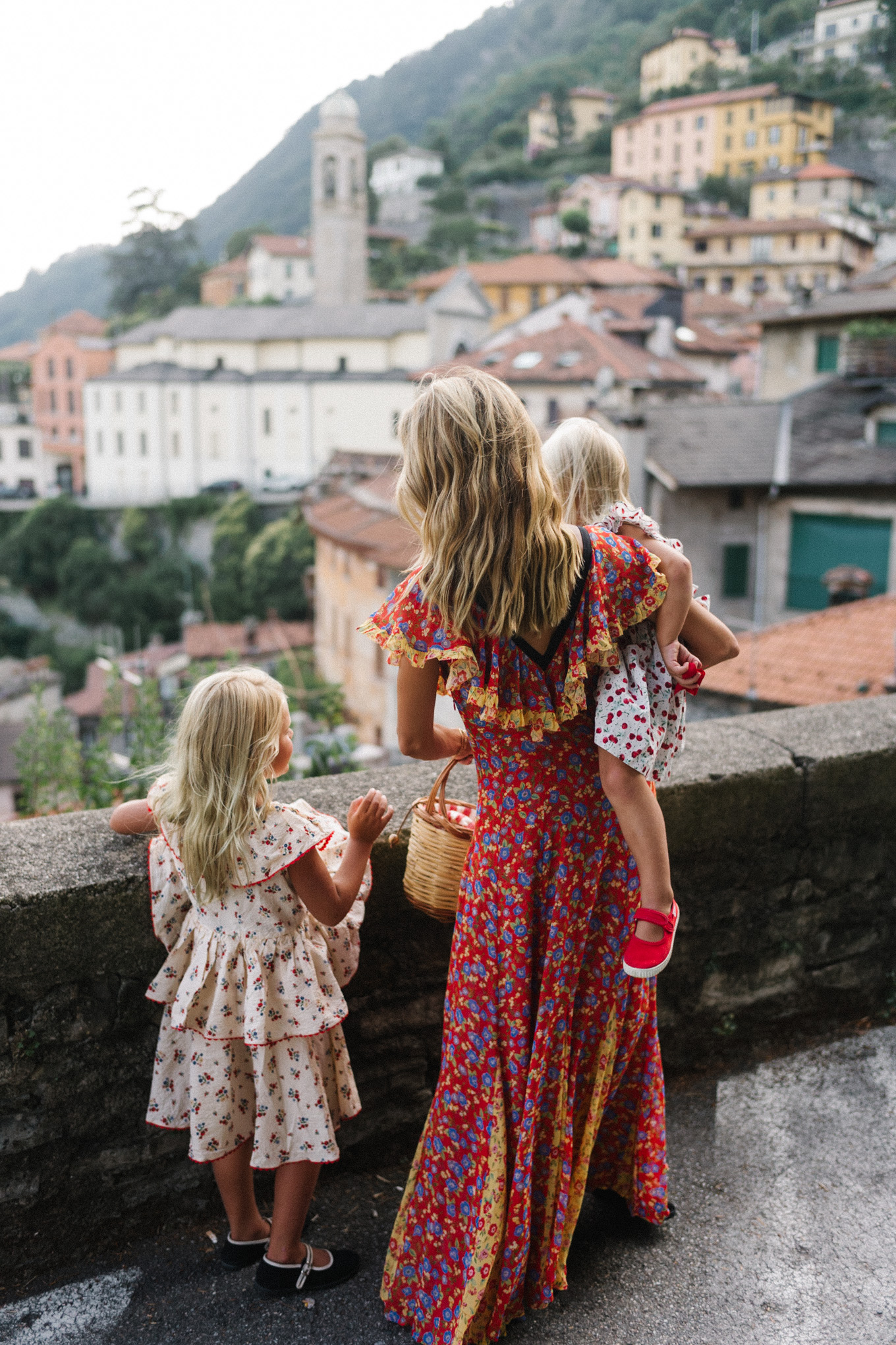 lake como italy red yellow blue floral dress