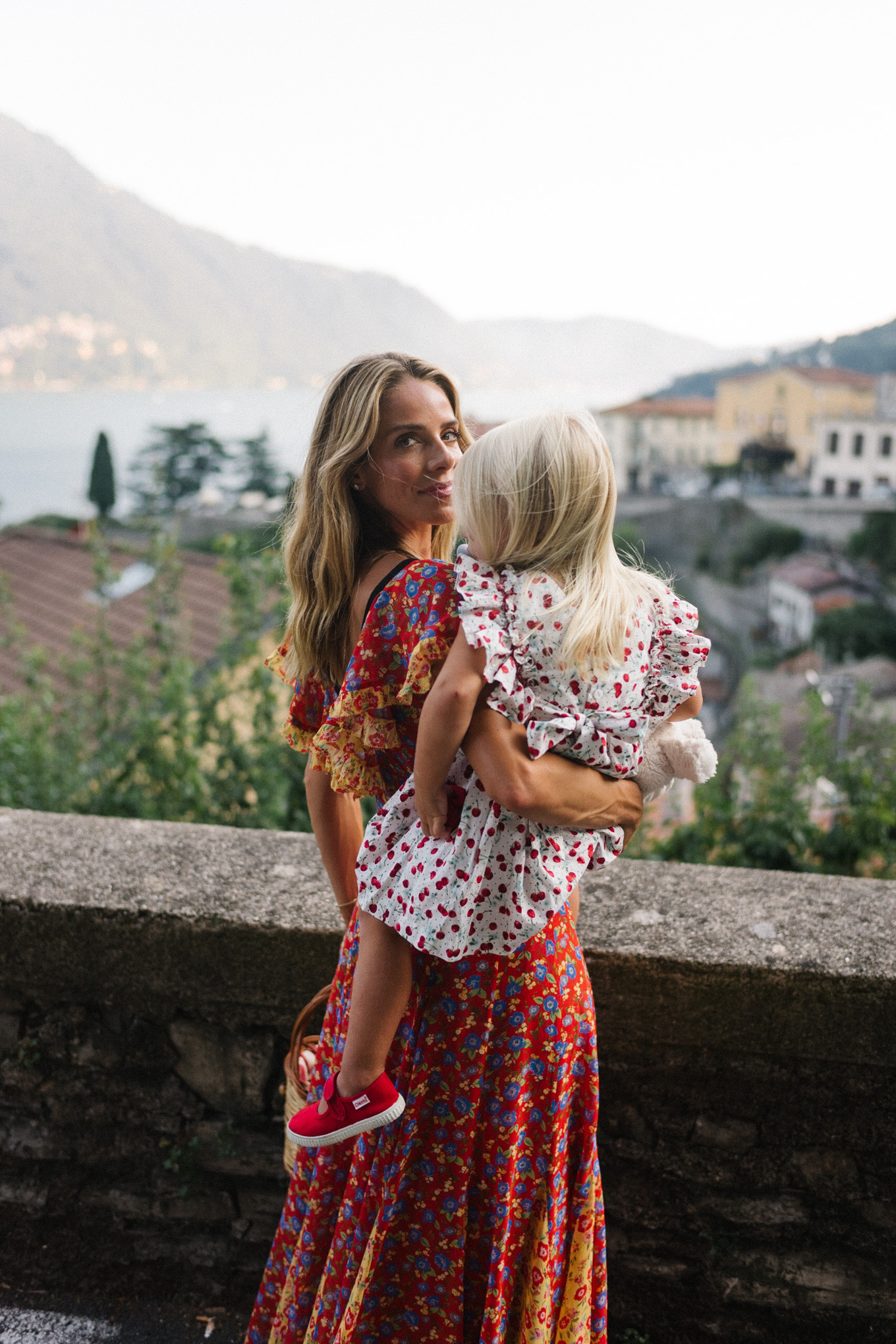 lake como italy red yellow blue floral dress