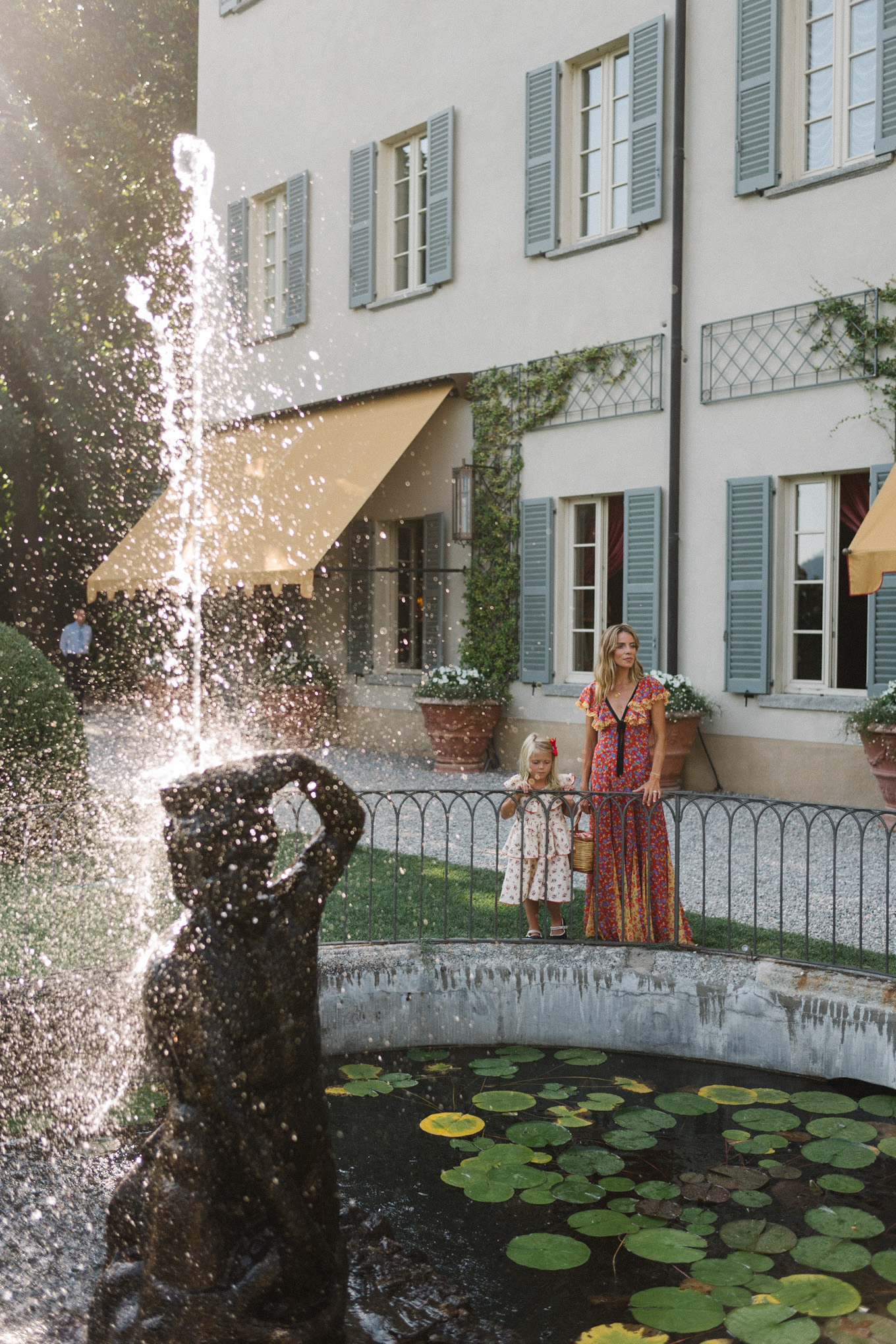 lake como italy red yellow blue floral dress