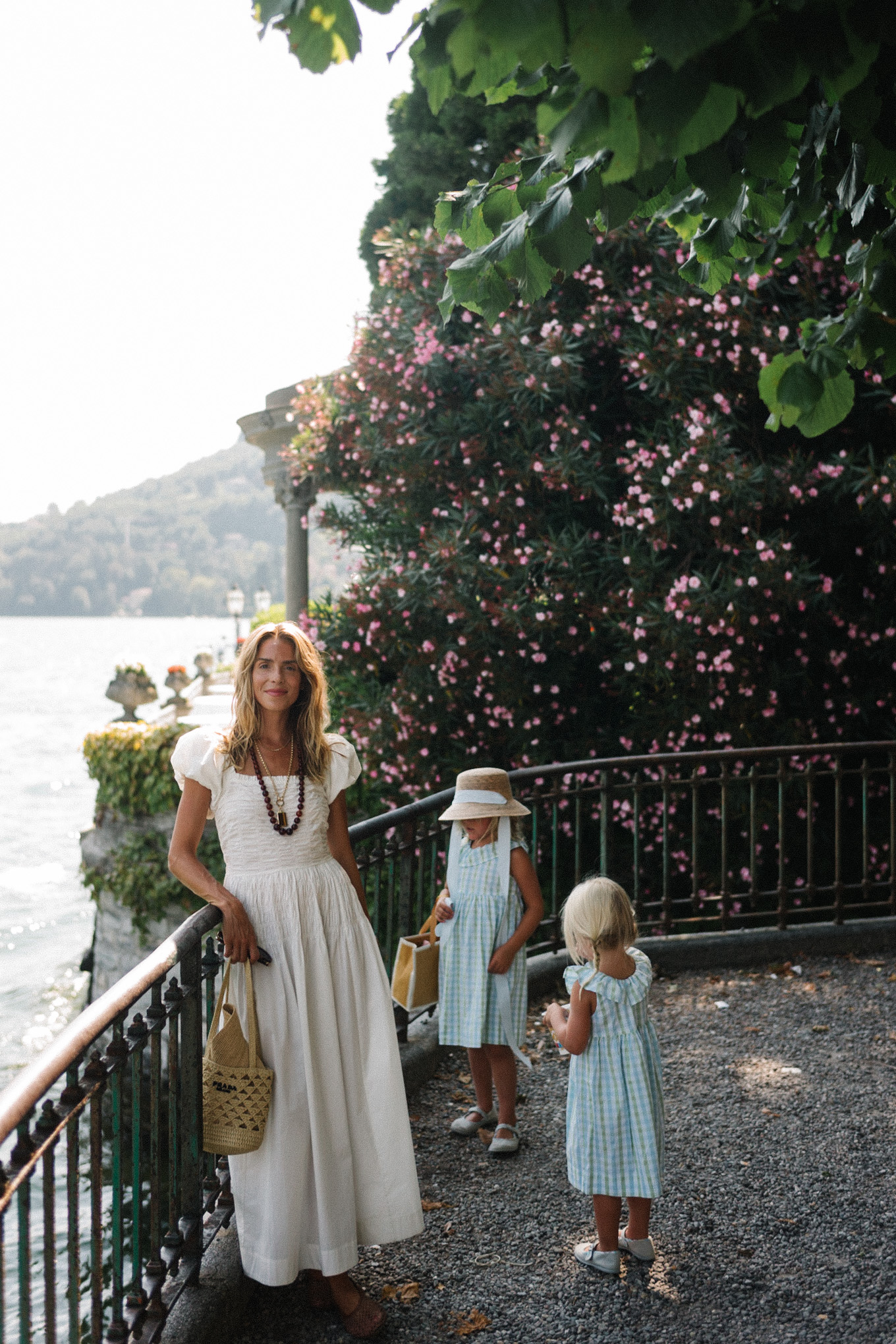 white cotton puff sleeve maxi dress brown beaded necklace