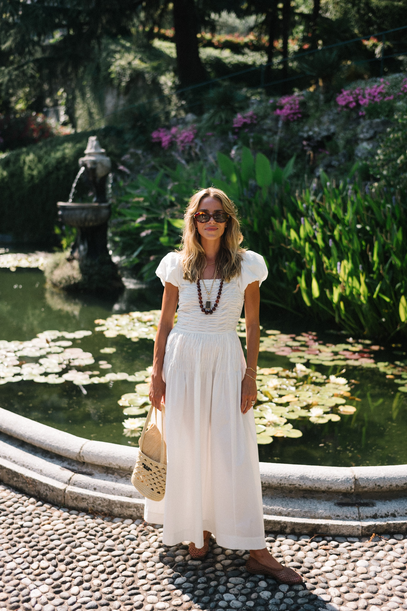 white cotton puff sleeve maxi dress brown beaded necklace