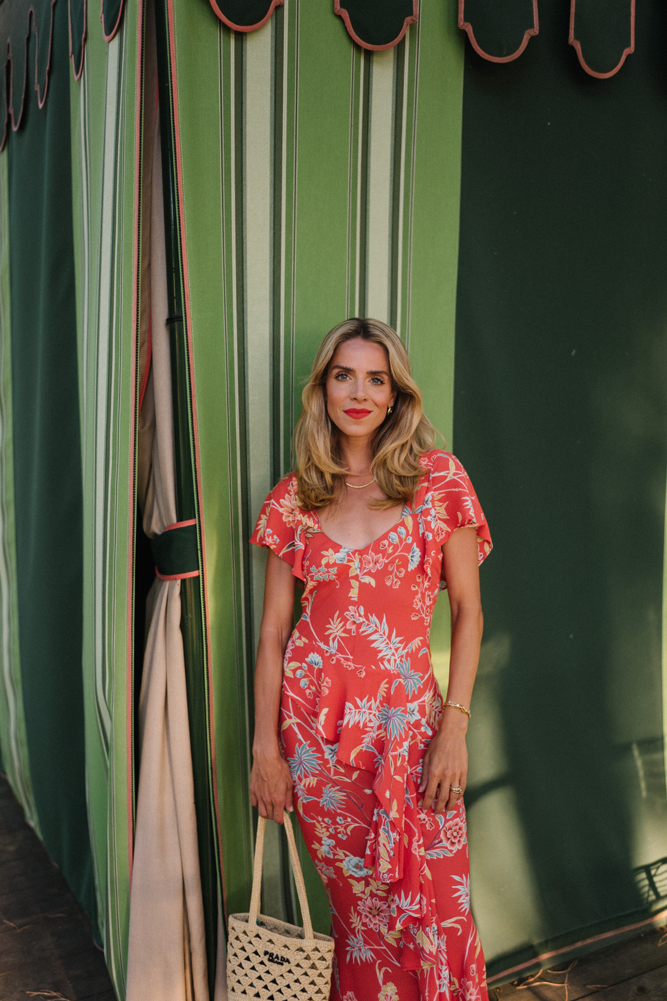 red floral midi dress straw bag