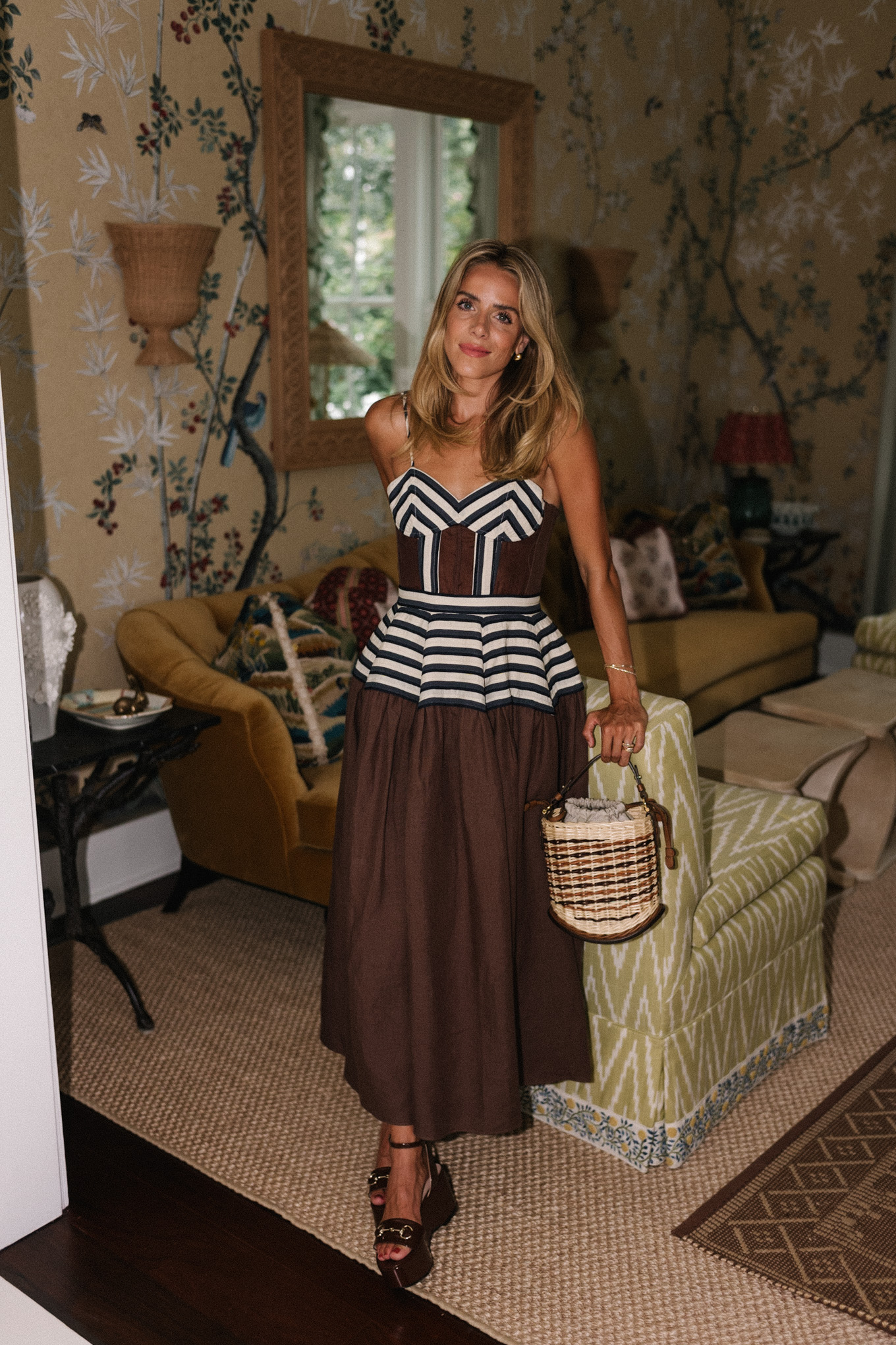 Brown and white maxi dress, straw bag and brown leather pumps