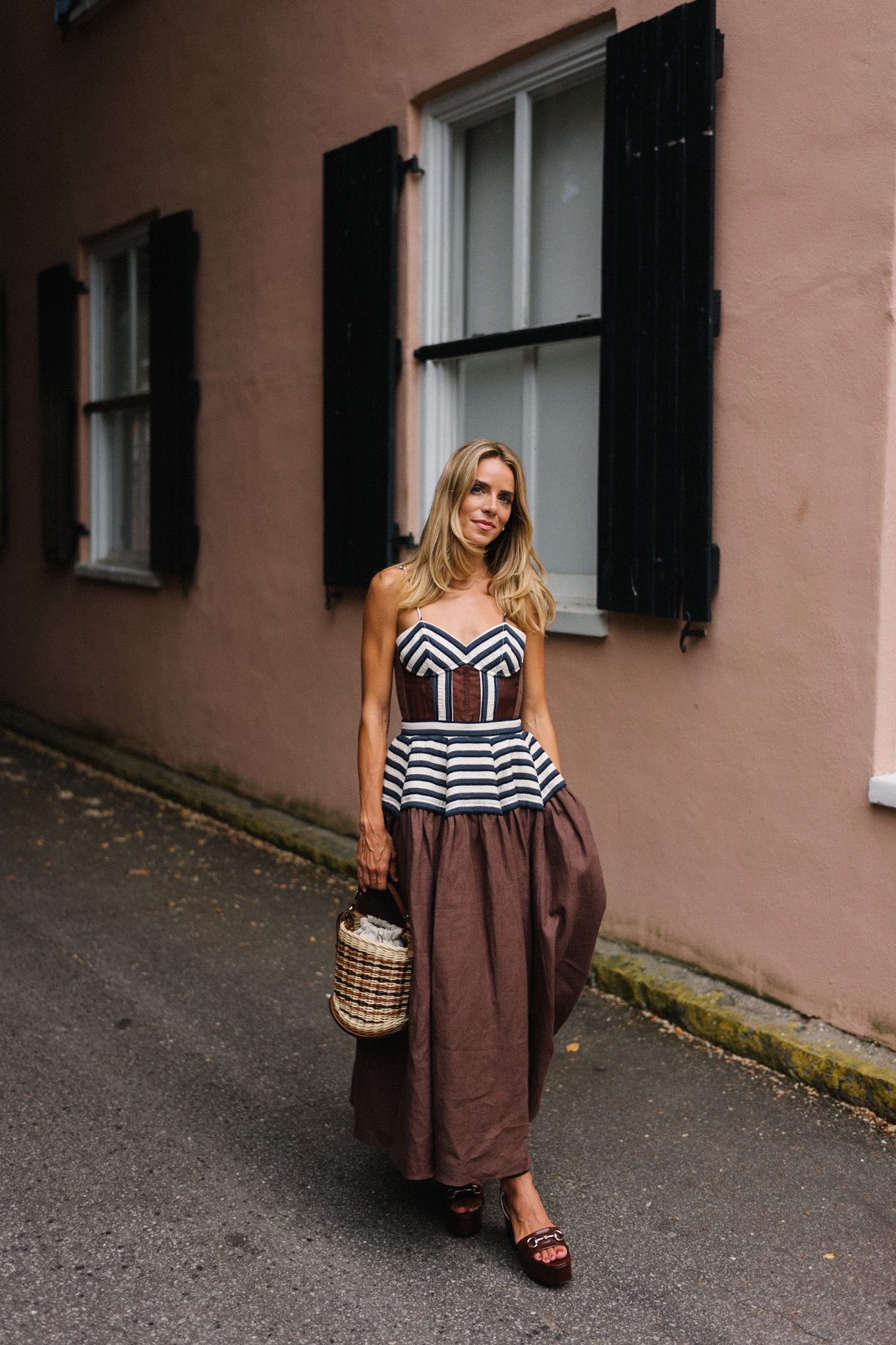 Brown and white maxi dress, straw bag and brown leather pumps