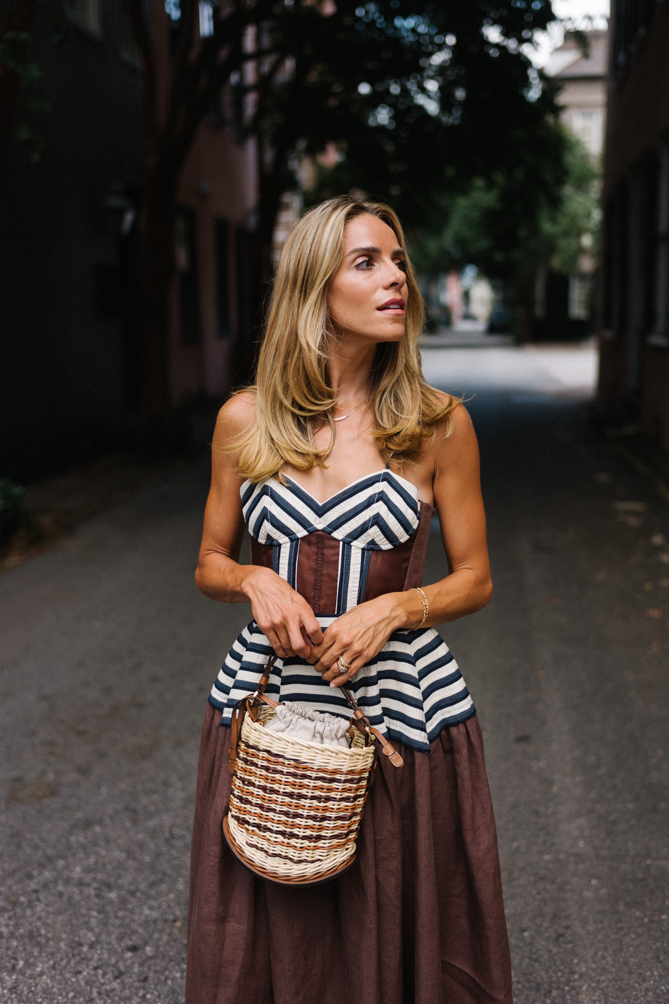 Brown and white maxi dress, straw bag and brown leather pumps