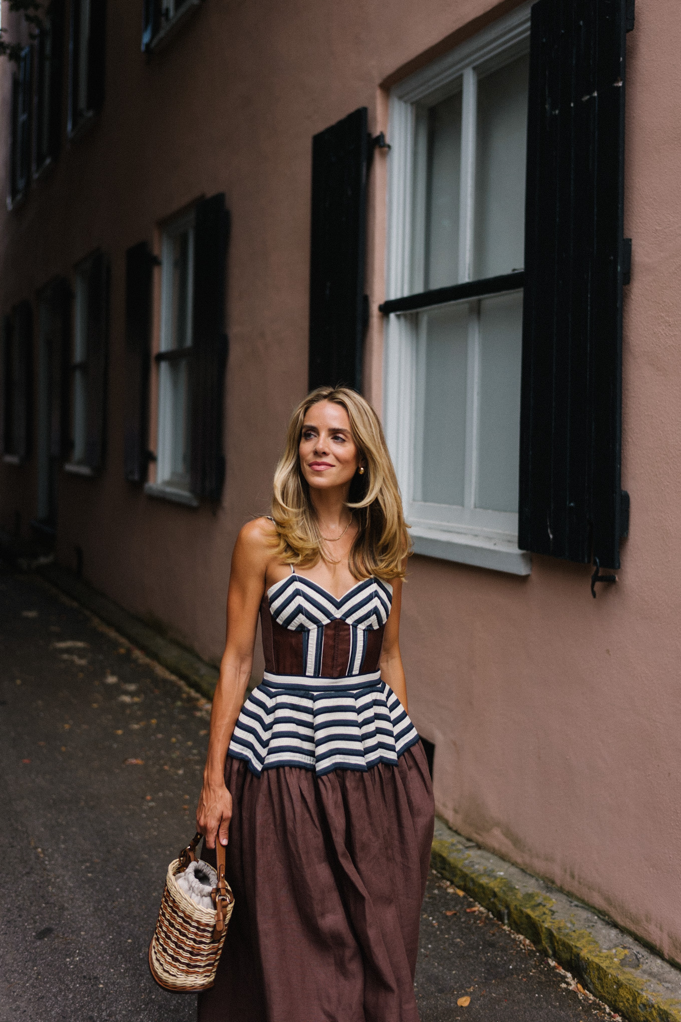 Brown and white maxi dress, straw bag and brown leather pumps