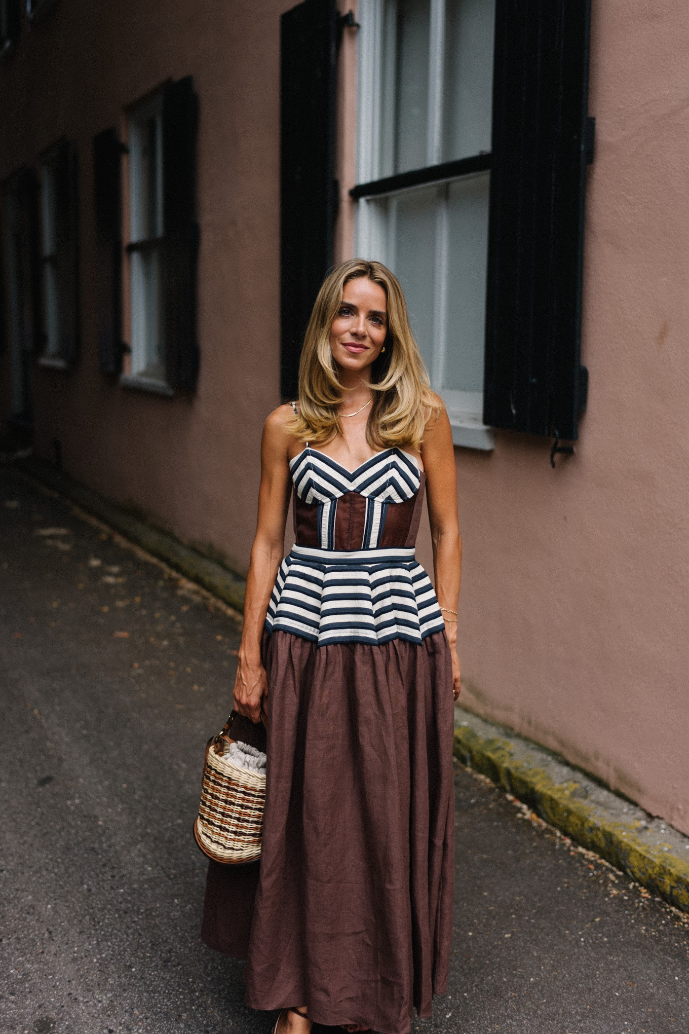 Brown and white maxi dress, straw bag and brown leather pumps