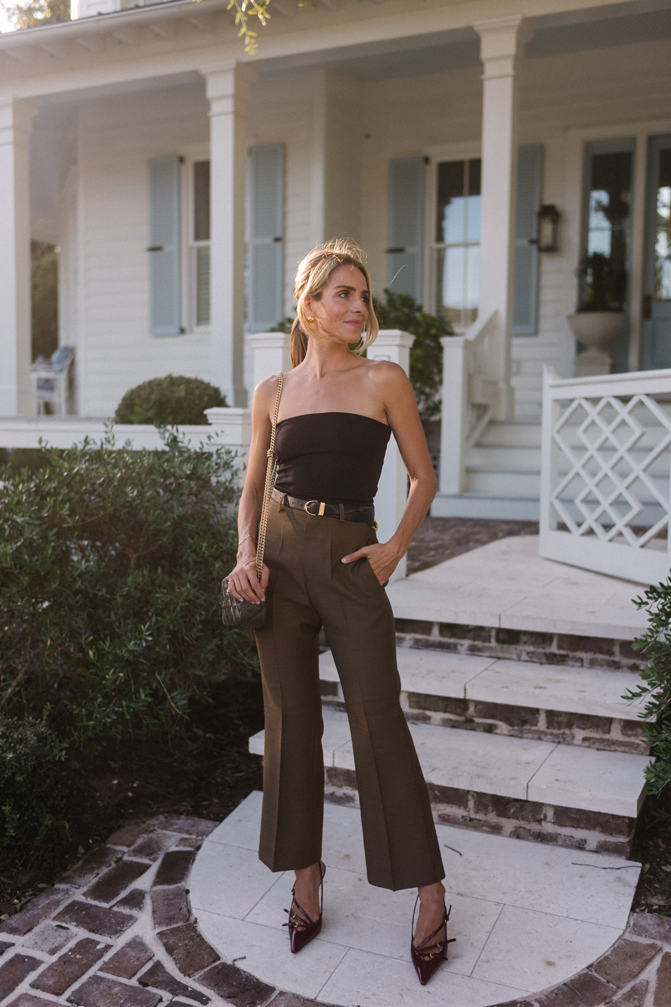 strapless black top brown silk trousers maroon patent leather slingback pumps