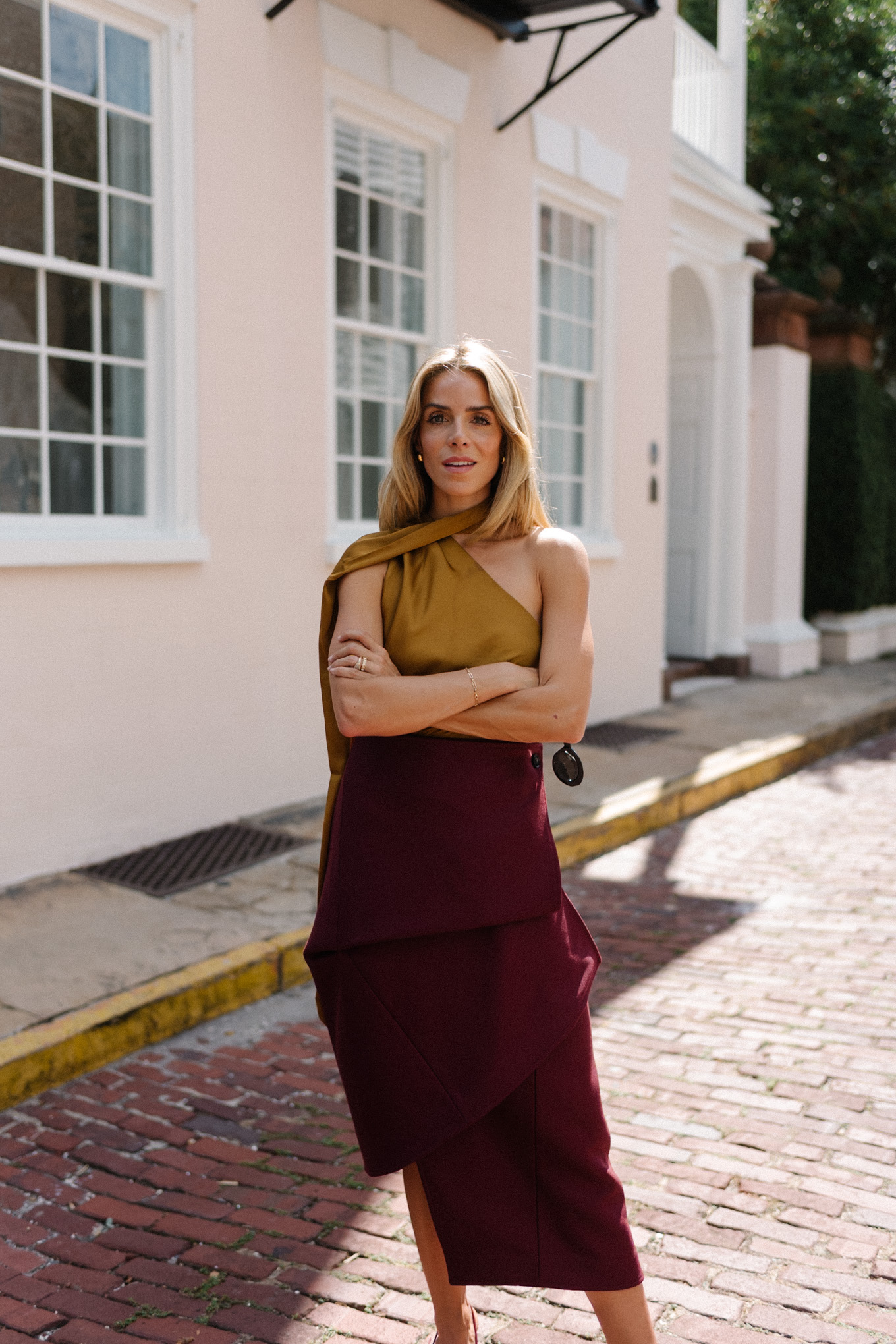 Burgundy leather jacket, burgundy midi skirt, gold silk shirt