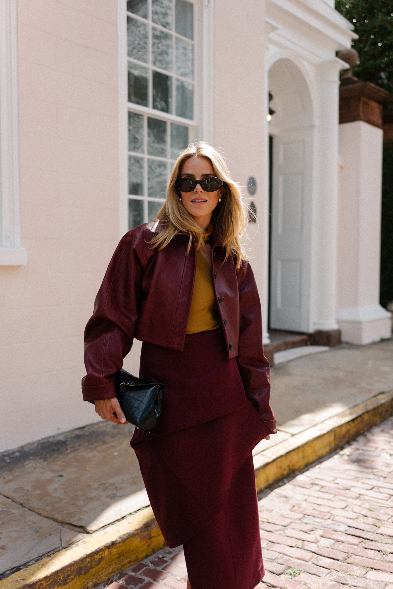 burgundy leather jacket burgundy midi skirt gold silk blouse