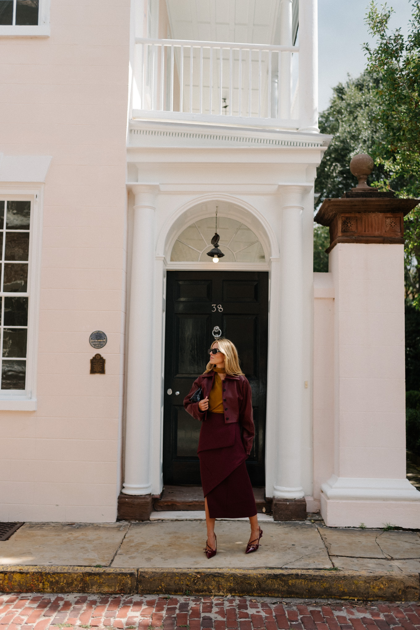 burgundy leather jacket burgundy midi skirt gold silk blouse