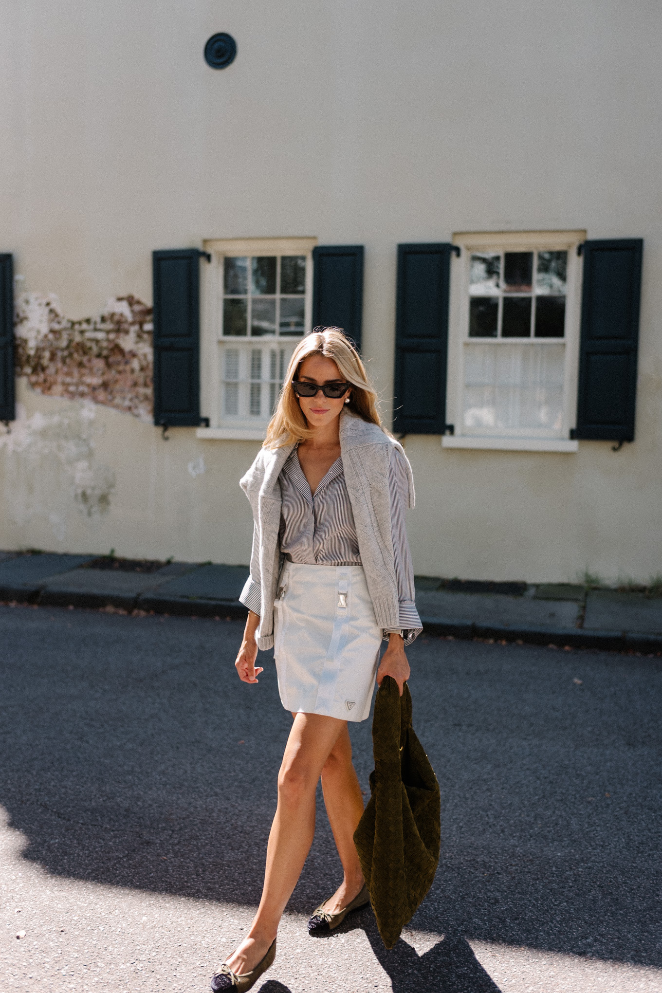 grey sweater striped button down white mini skirt suede hobo bag