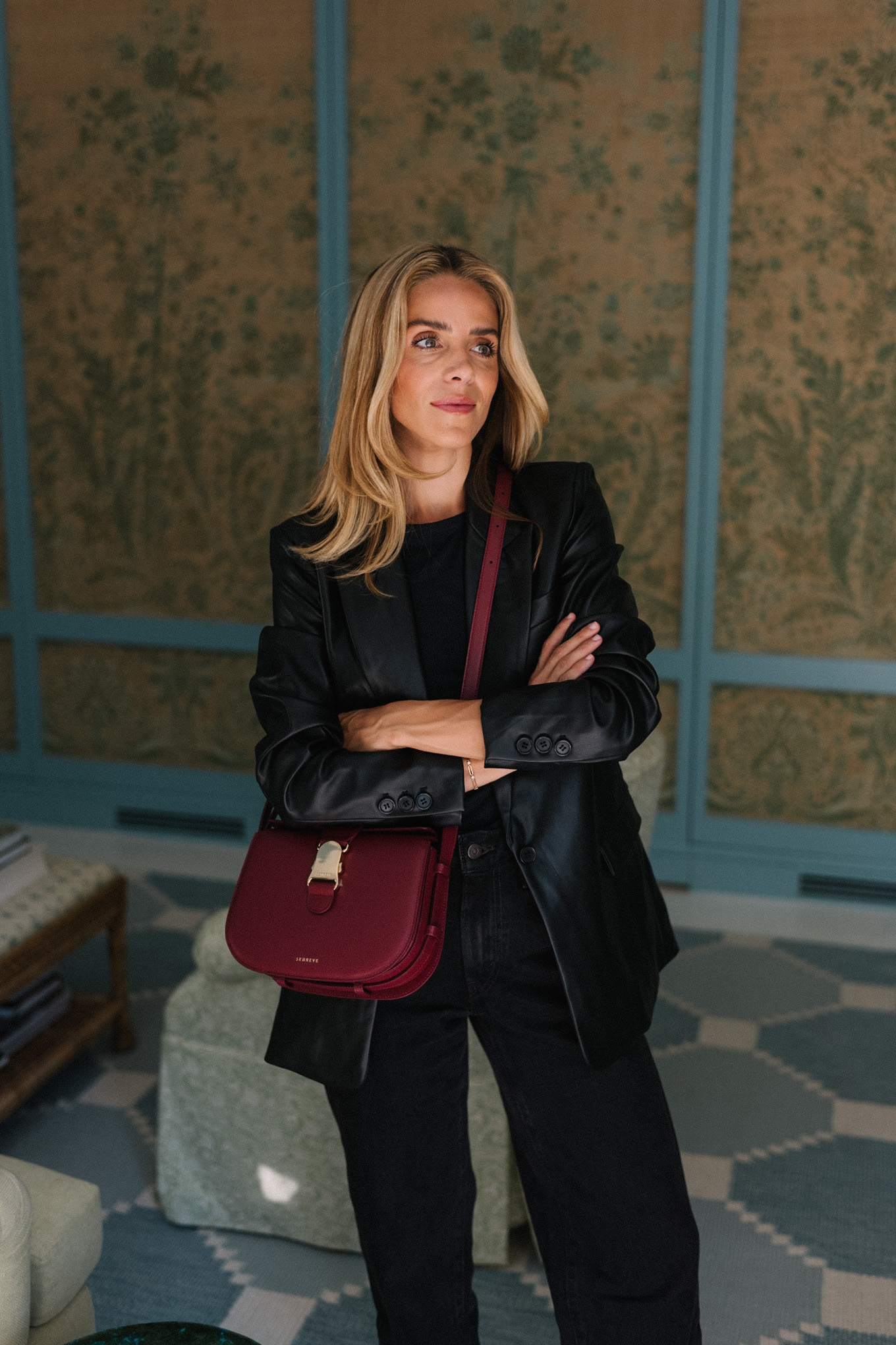 black leather blazer black denim jeans burgundy handbag