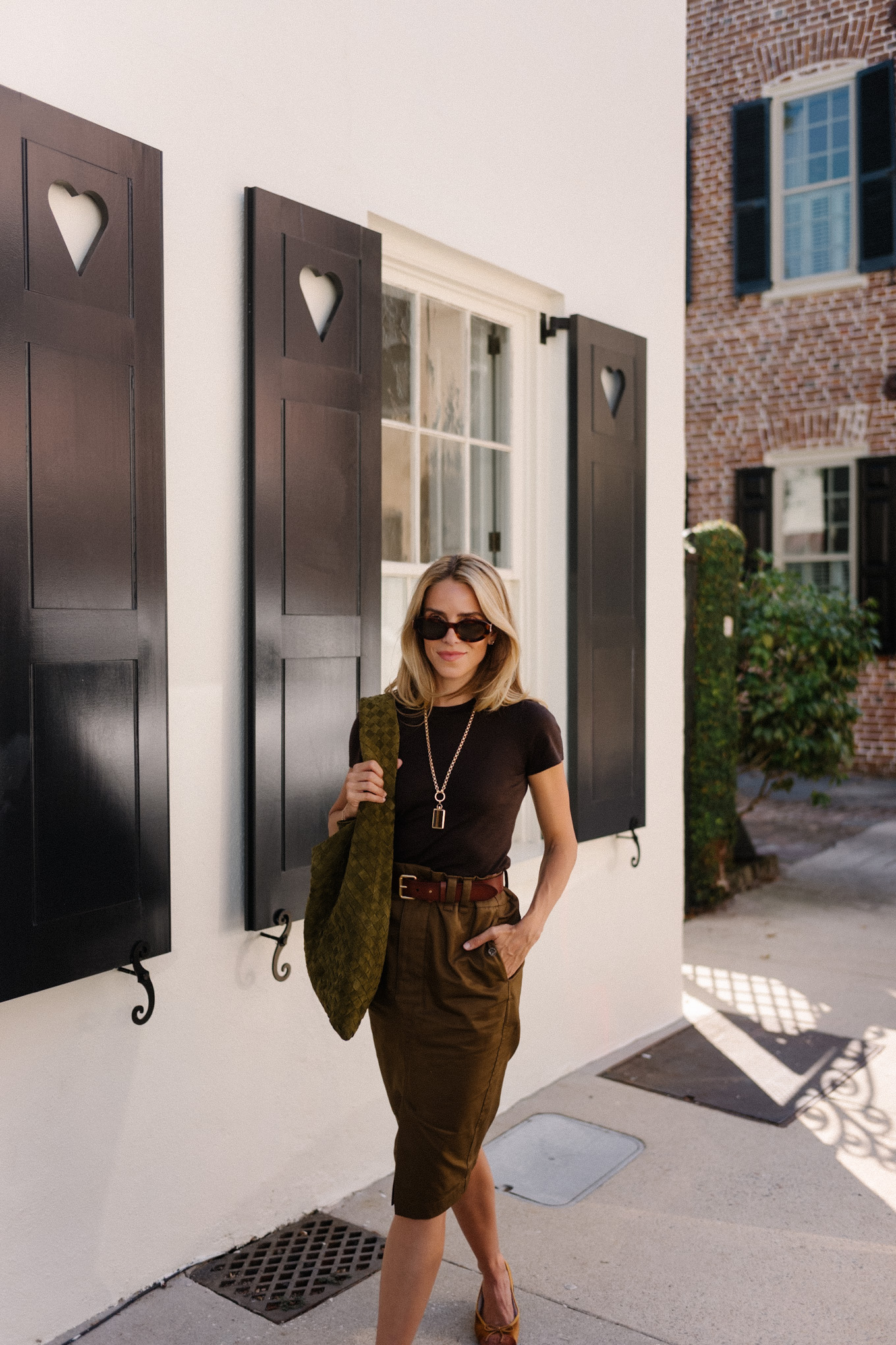 Black T-shirt Brown belted midi skirt Suede hobo bag