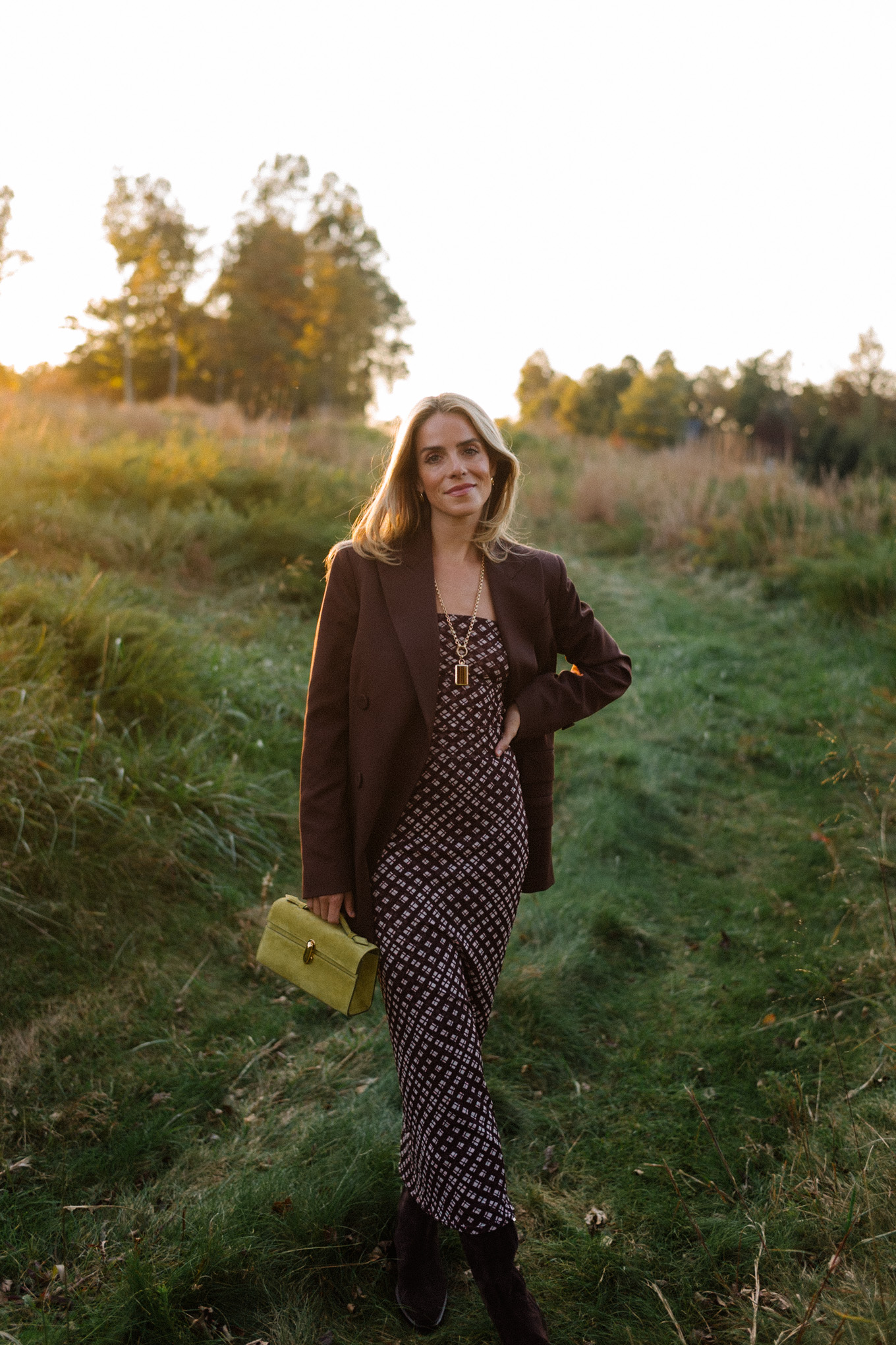 Brown mesh plaid skirt suit, brown suit jacket, brown boots, green suede bag