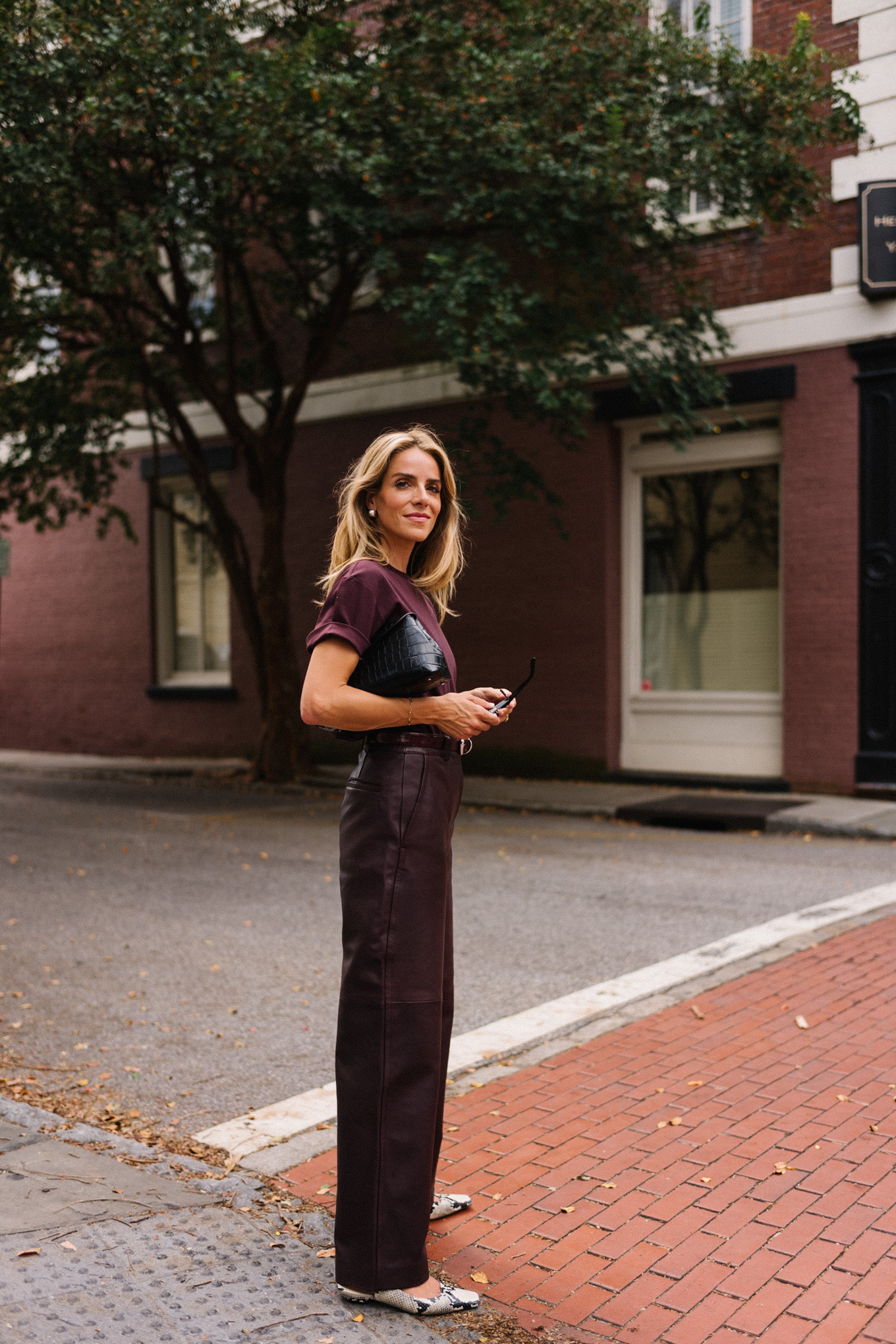 Chestnut T-shirt, chestnut leather pants, snakeskin flats