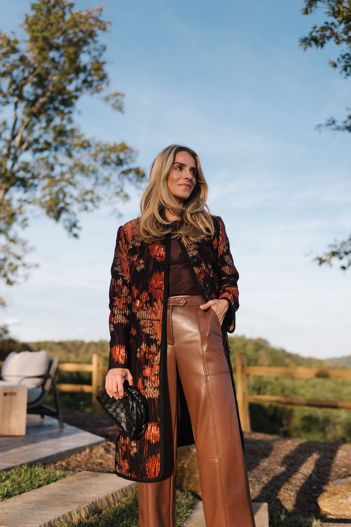 floral pleated car coat brown leather pants