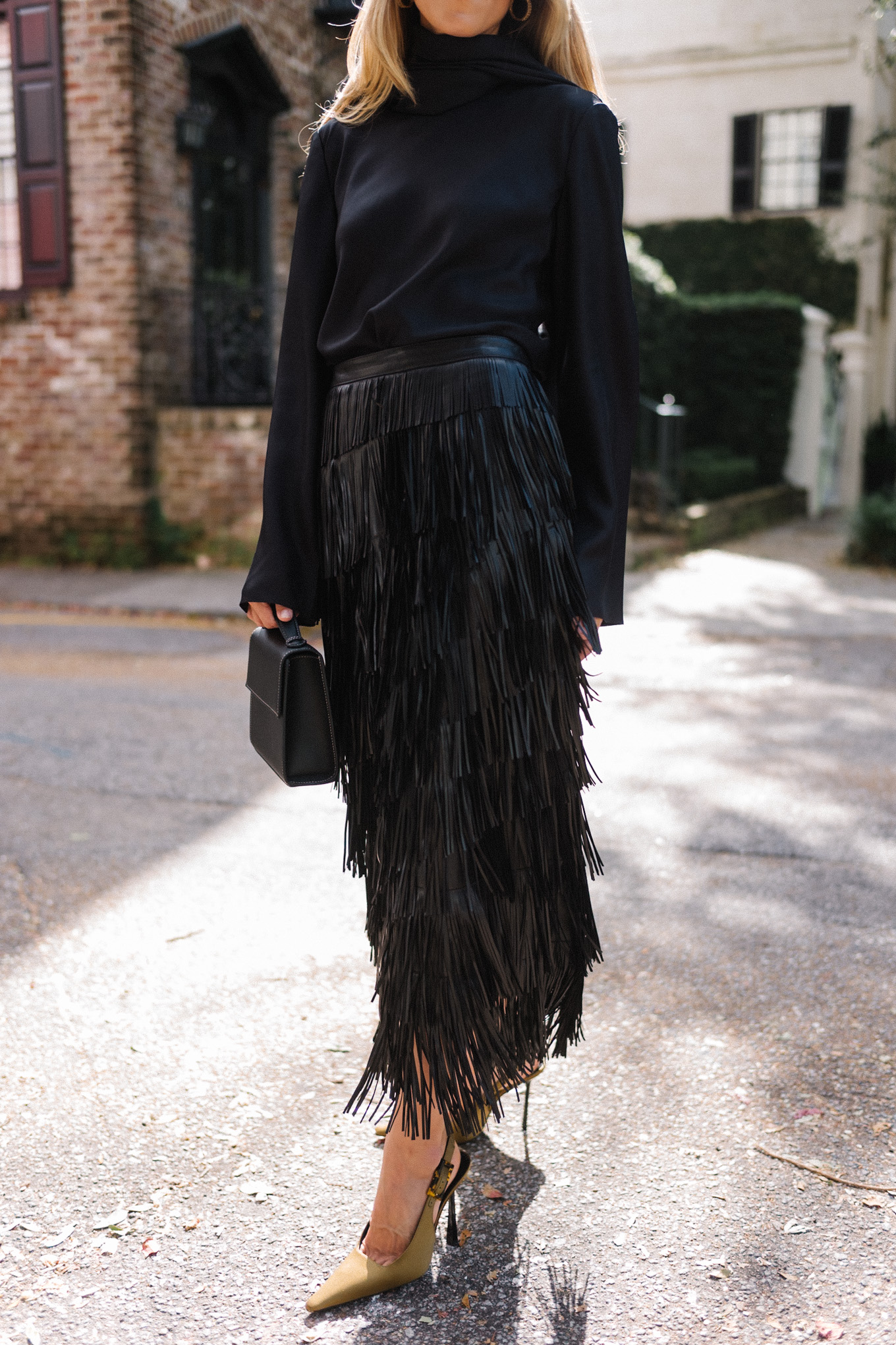 black silk wrap blouse black leather fringe skirt chartreuse pumps black leather handbag