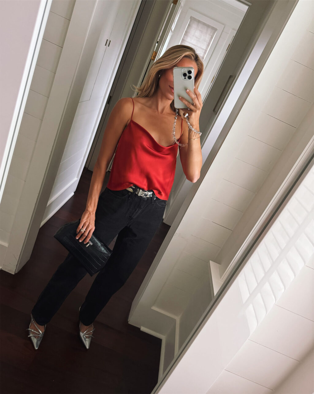 Red silk vest snakeskin belt black pants silver high heels