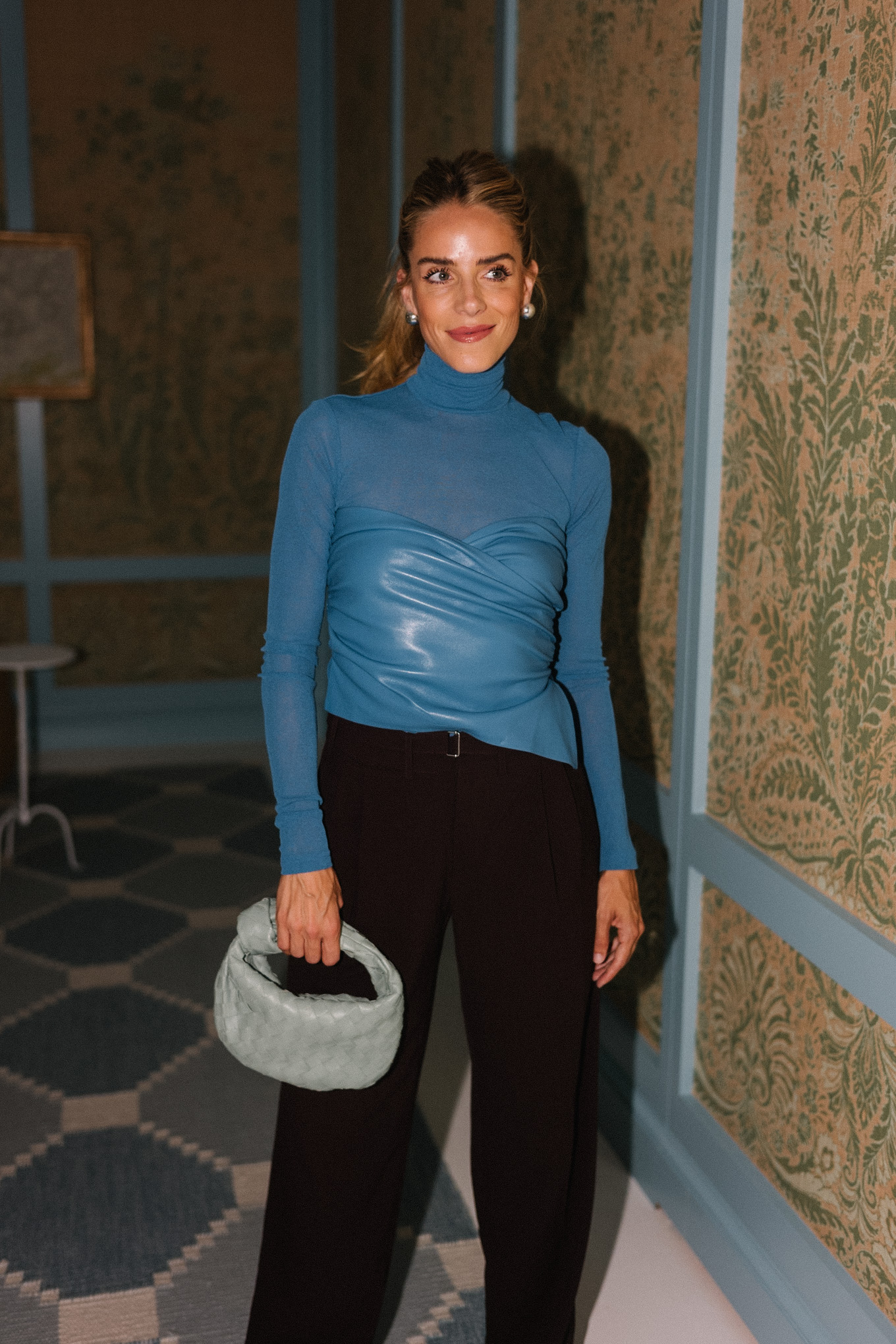 blue leather turtleneck black pants silver pumps silver bag