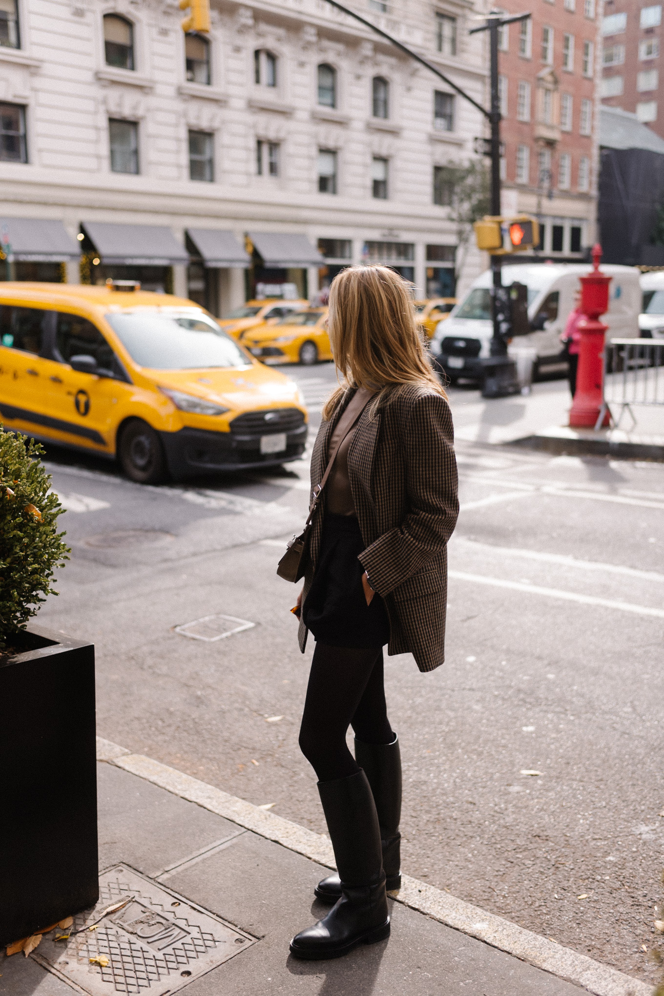 checked wool blazer green turtleneck black skirt black boots silver bag