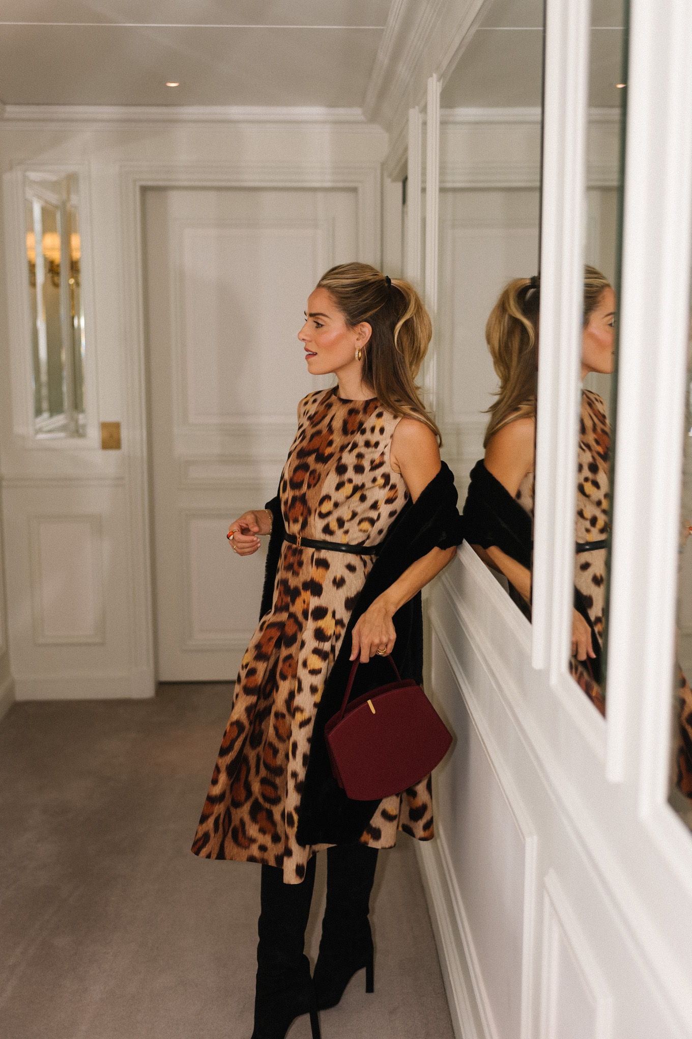 leopard dress black boots maroon bag