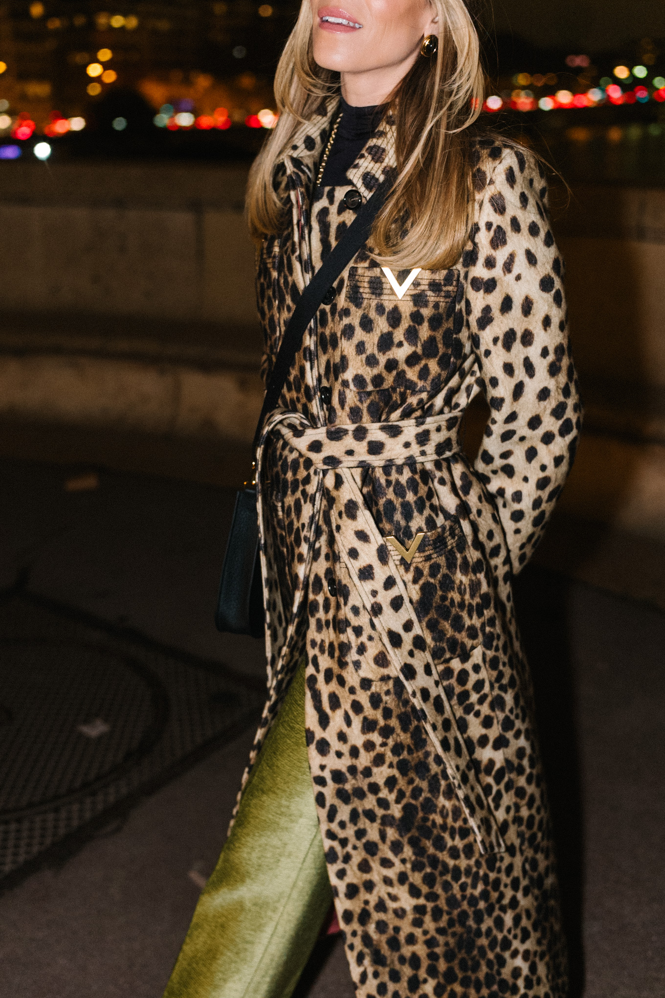 leopard winter coat green satin pants black pumps black leather bag