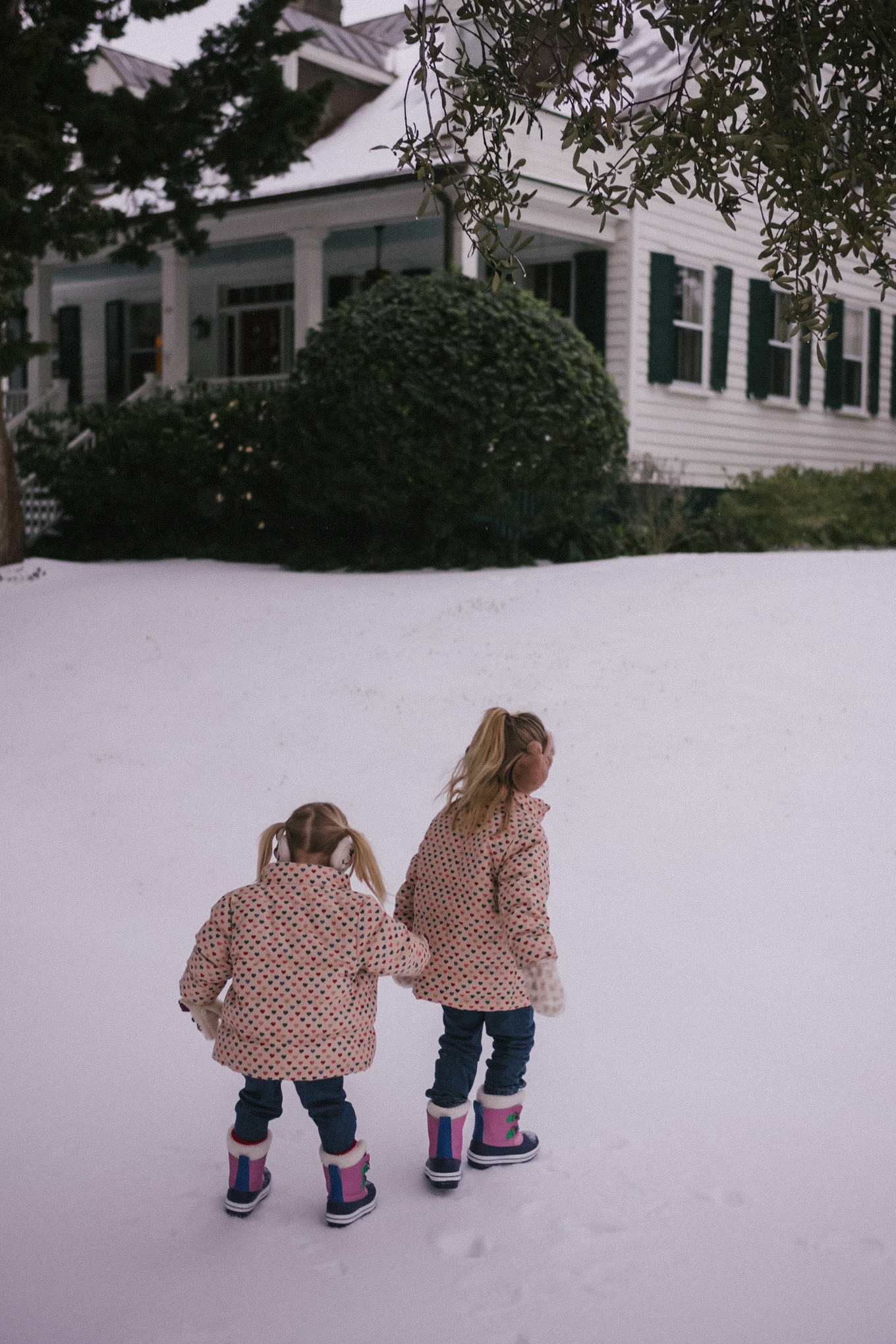 pink wool coat pink beanie blue denim snow gear