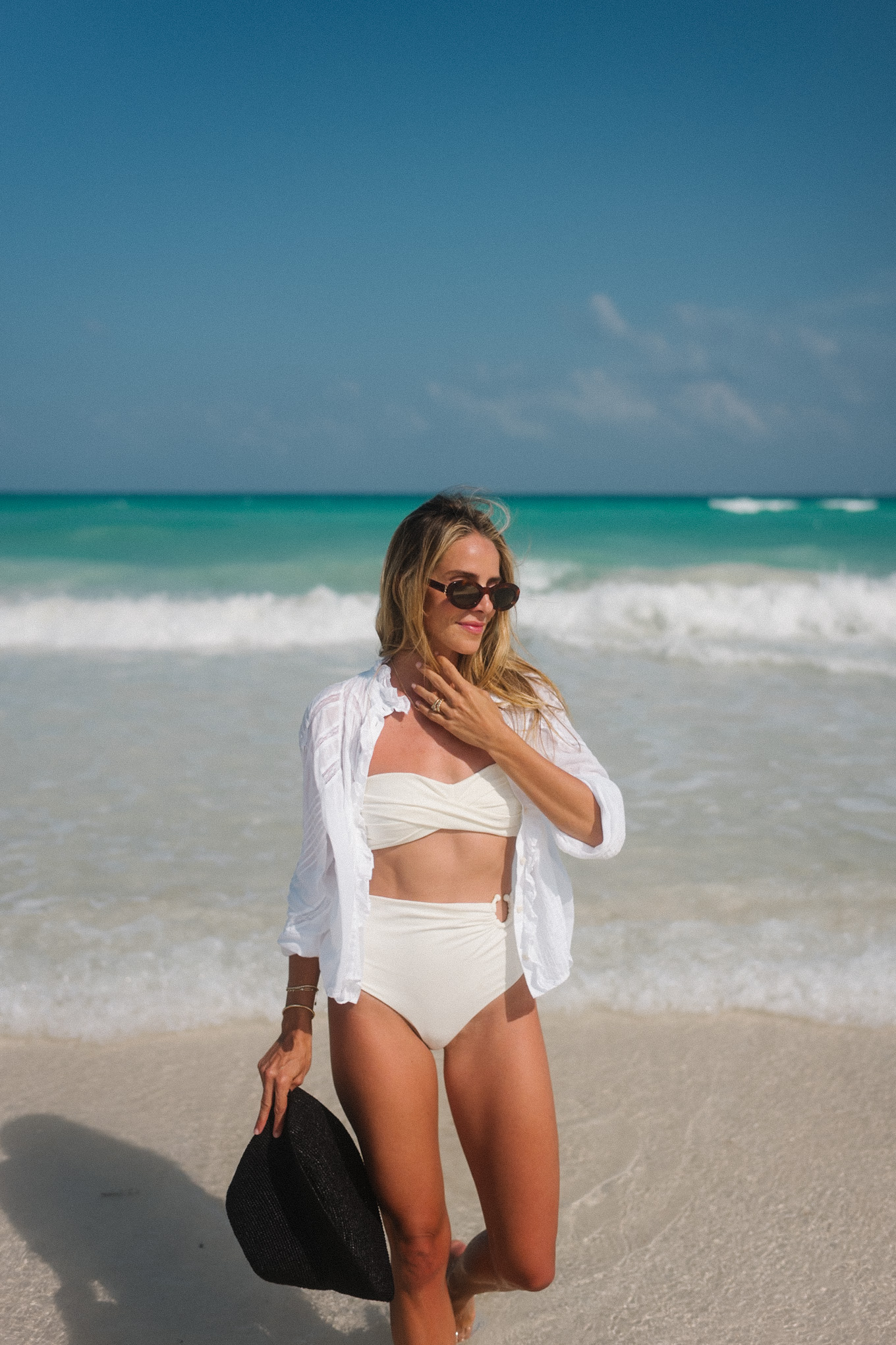 white swim black straw hat white button down white lace shorts