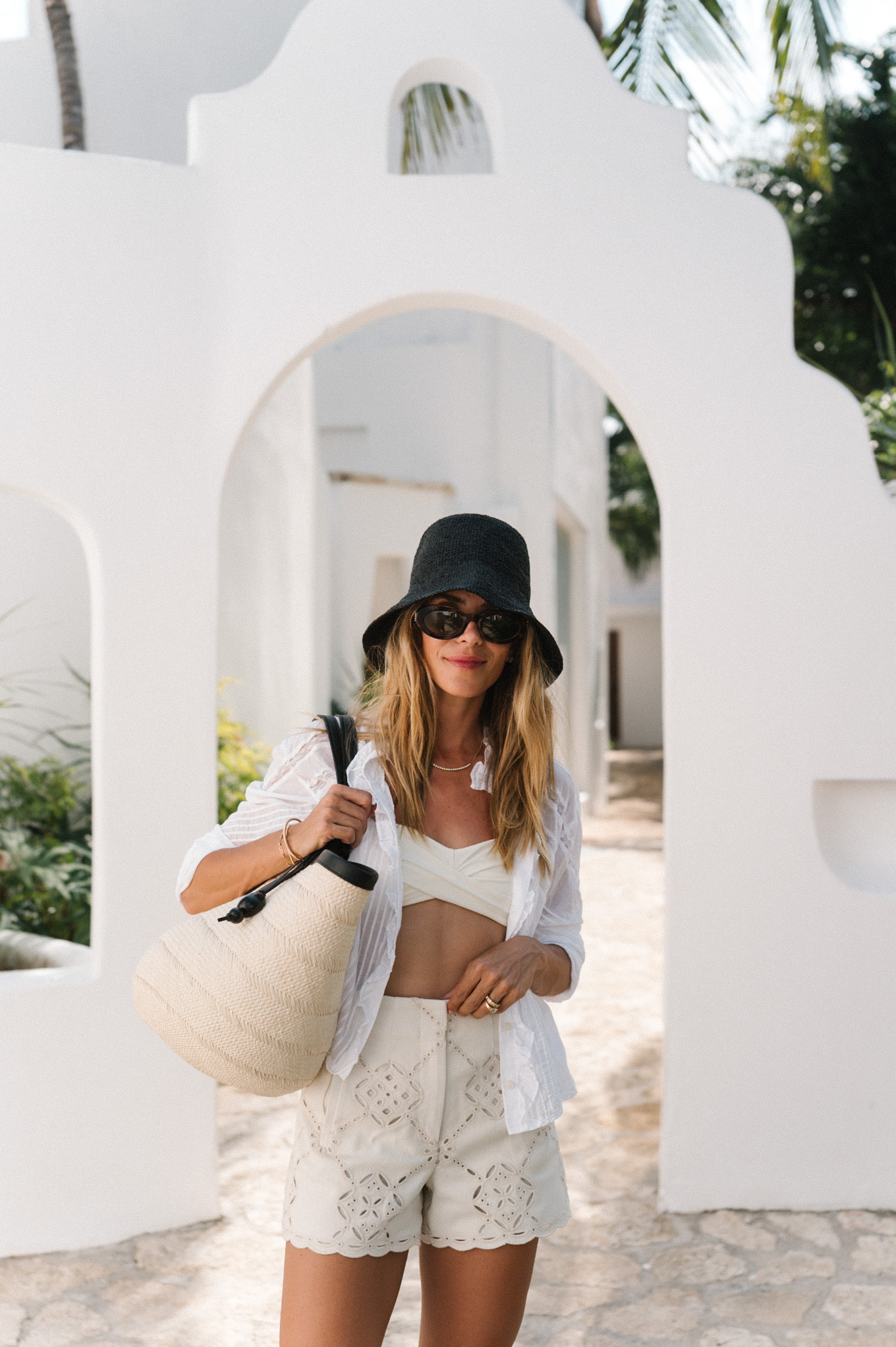 white swim black straw hat white button down white lace shorts