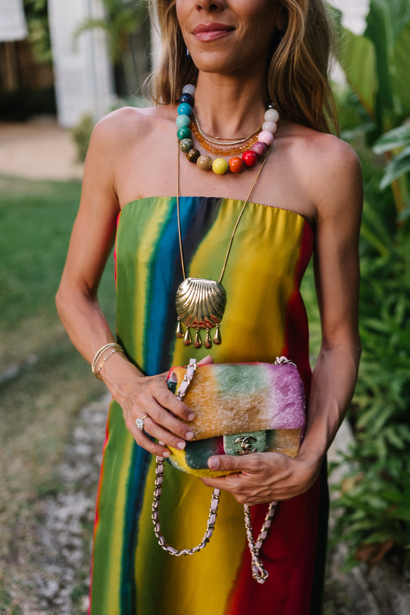 silk rainbow stripe maxi dress rainbow beaded necklace gold seashell necklace rainbow bag