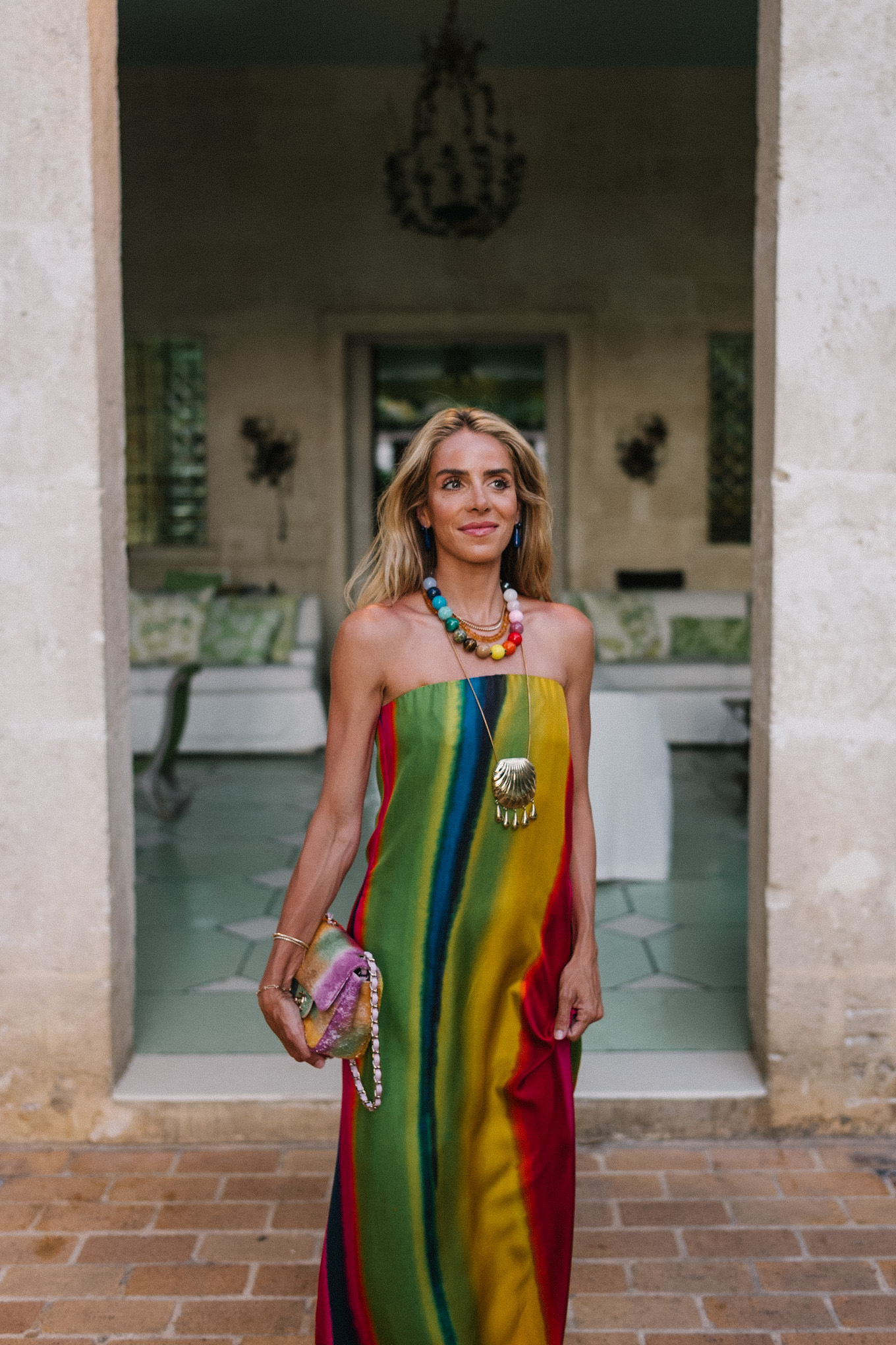 silk rainbow stripe maxi dress rainbow beaded necklace gold seashell necklace rainbow bag