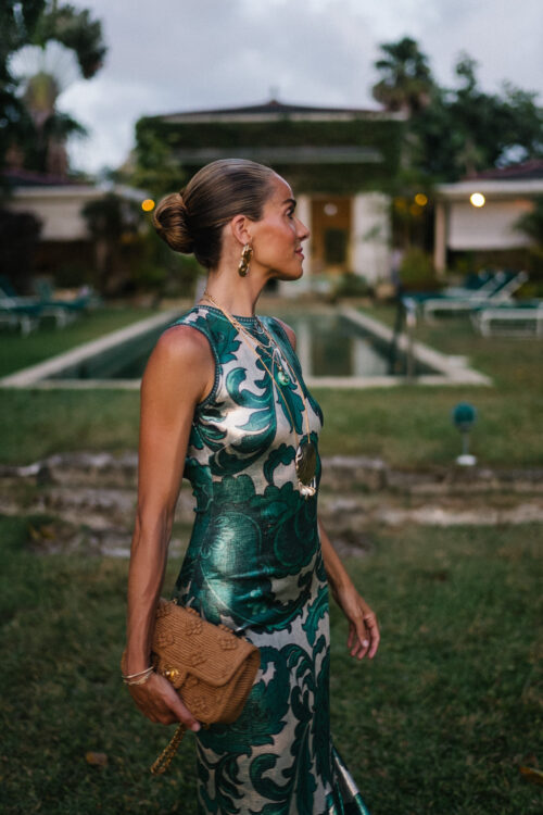 barbados sparkly green paisley maxi dress gold earrings woven bag