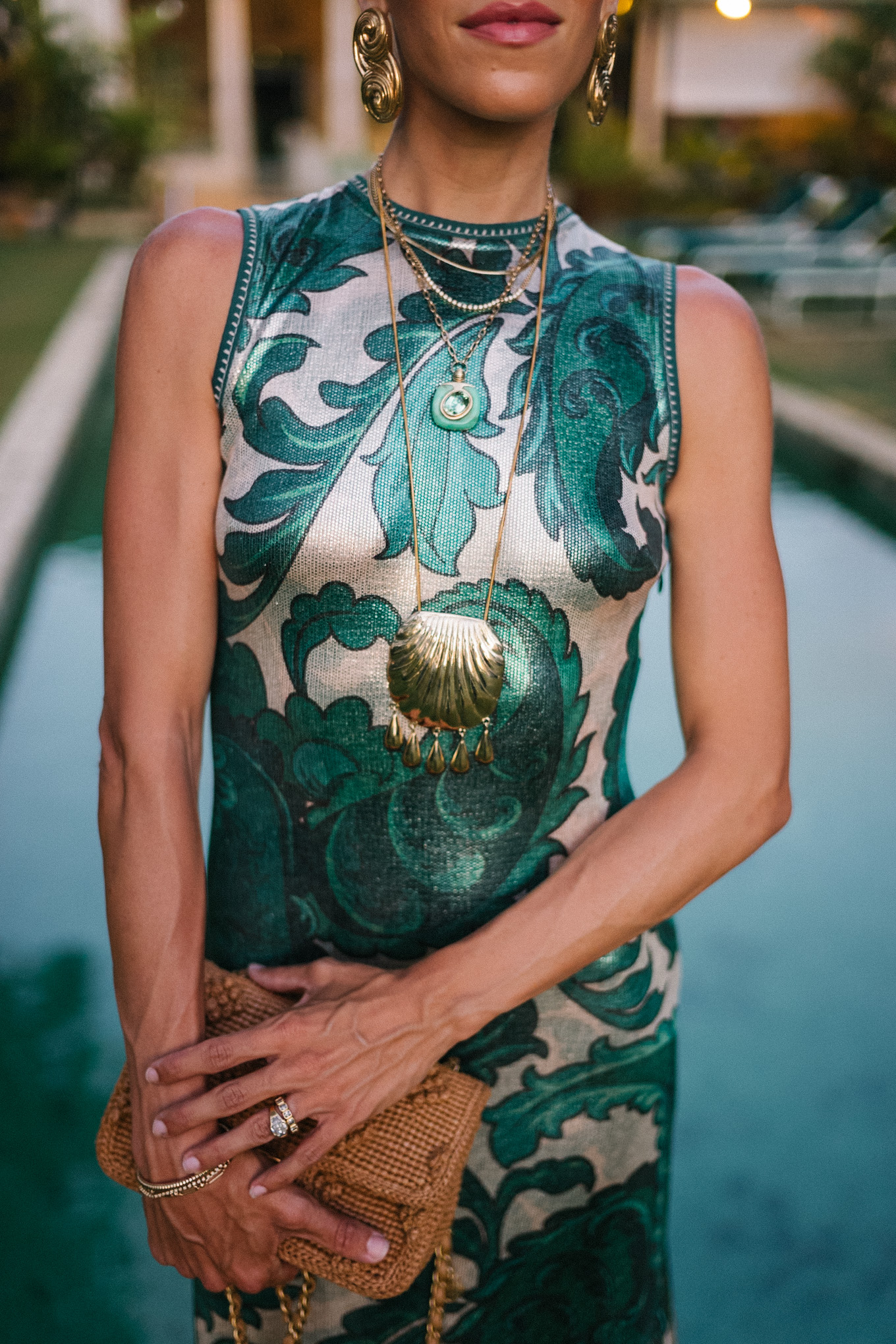 Barbados Sparkly Green Paisley Maxi Dressed in gold slopes of gold fabric bag
