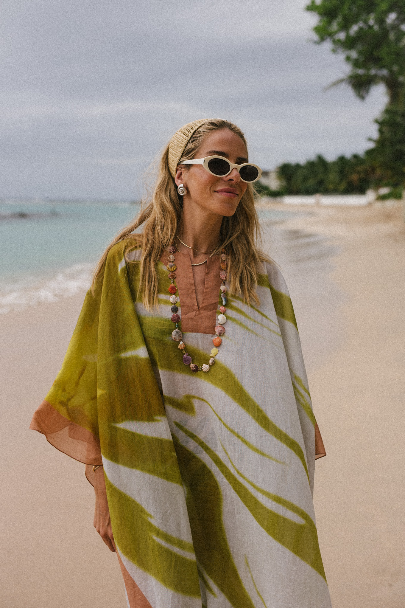 green pink kaftan black pink graphic bikini woven headband white sunglasses