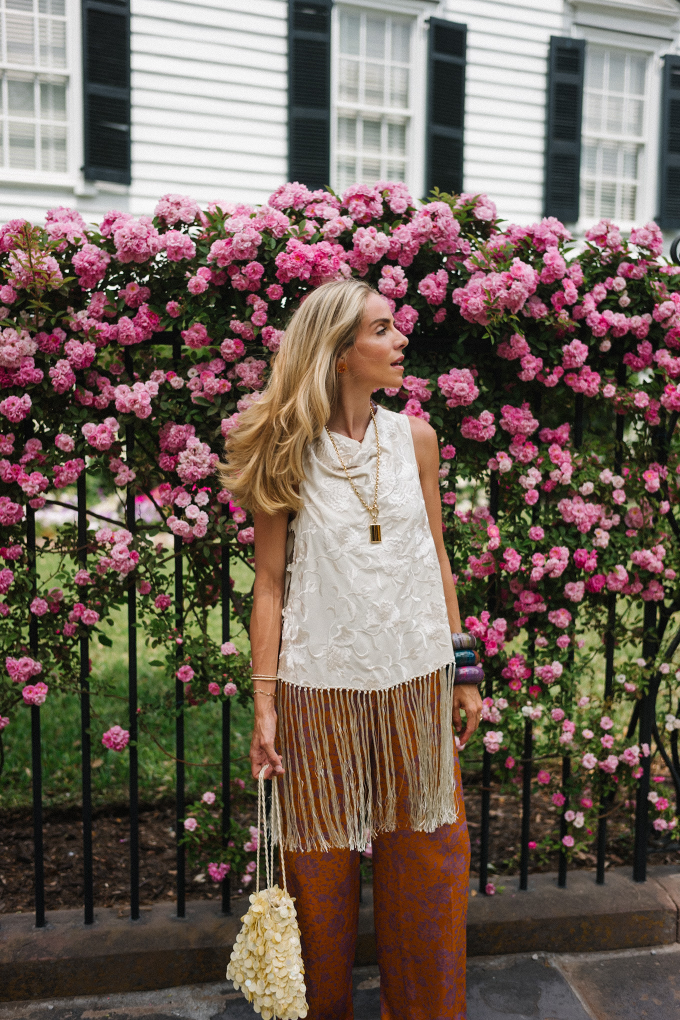 white silk fringe tank burnt orange silk pants sequin bag