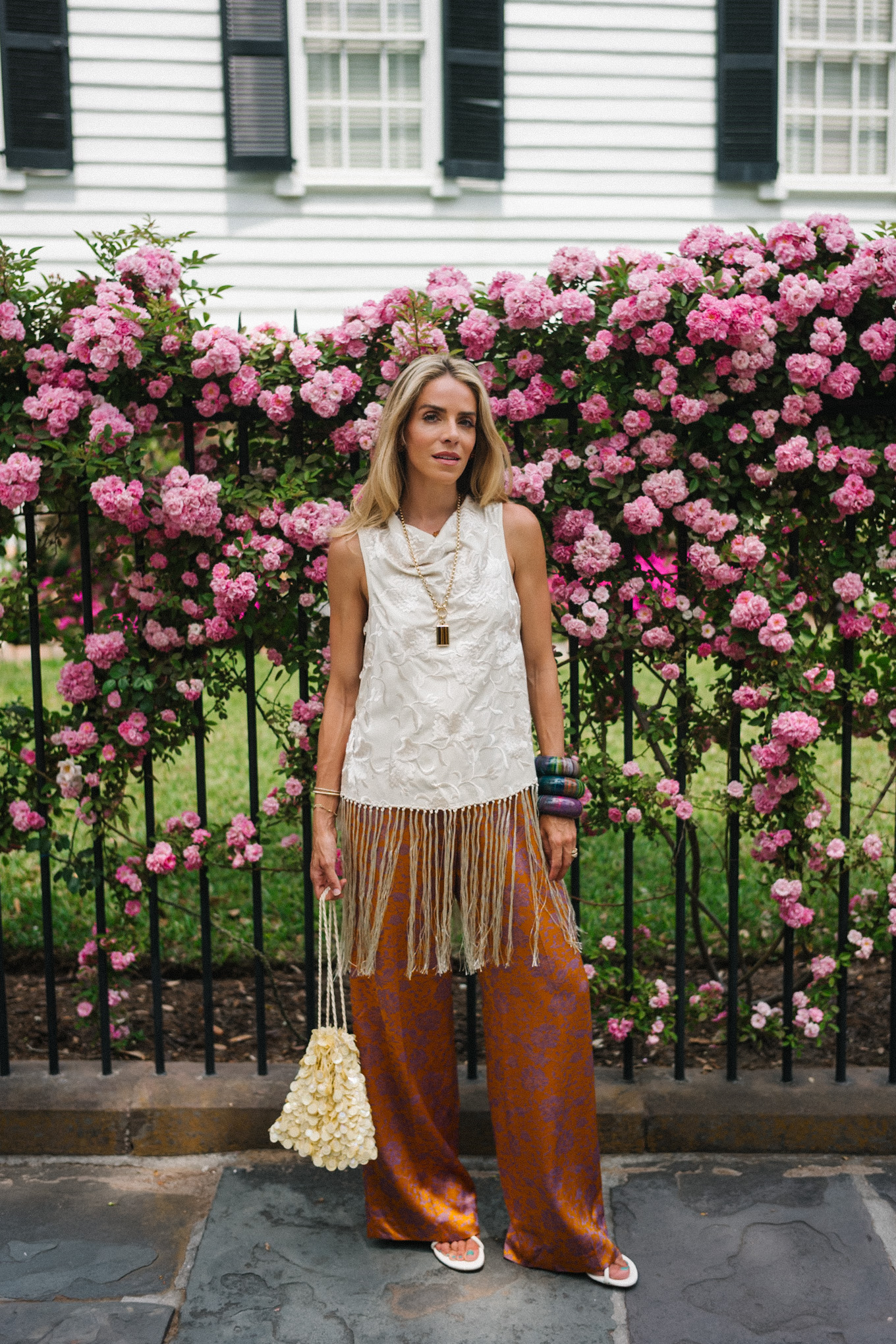 white silk fringe tank burnt orange silk pants sequin bag