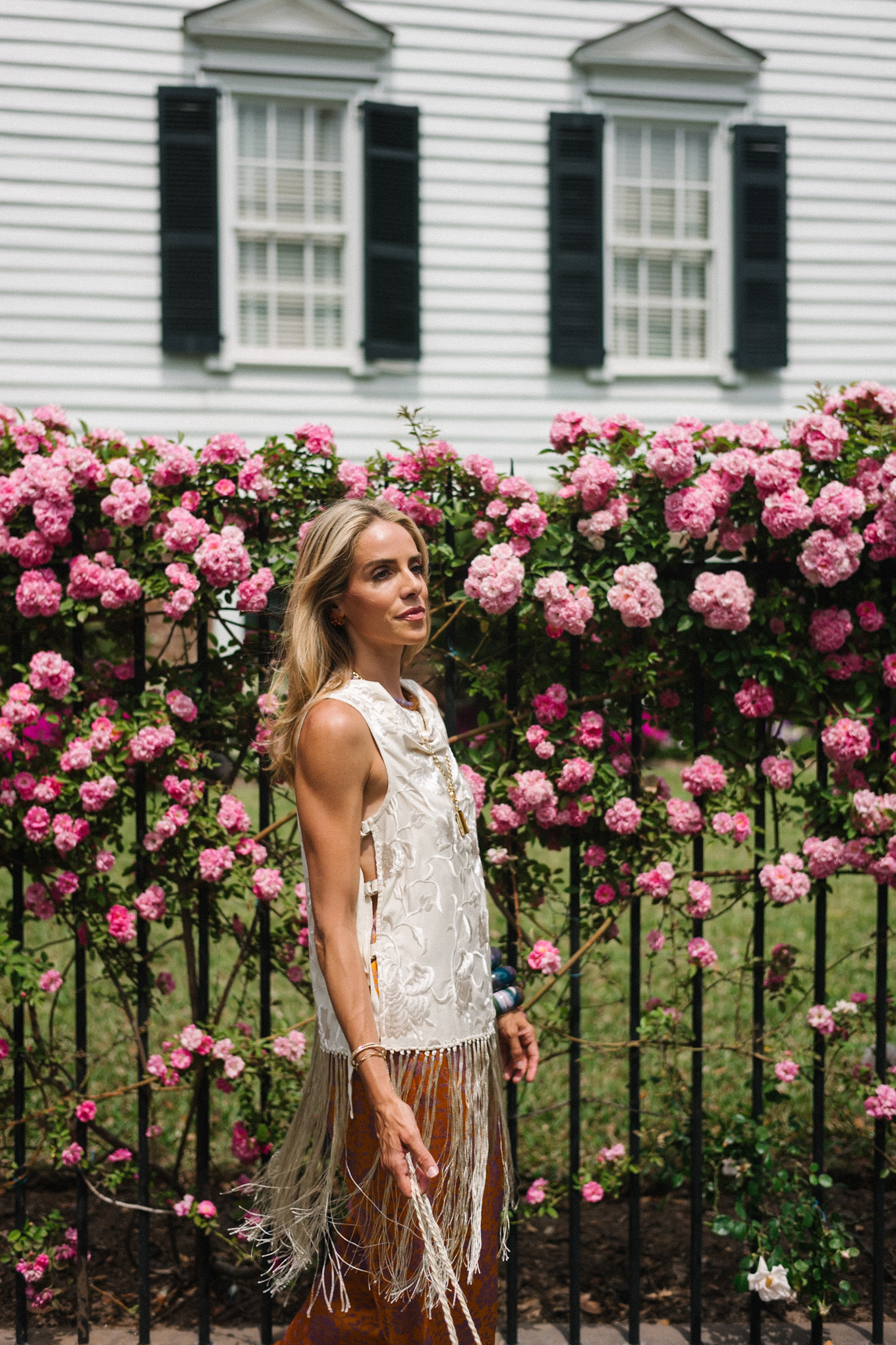 white silk fringe tank burnt orange silk pants sequin bag