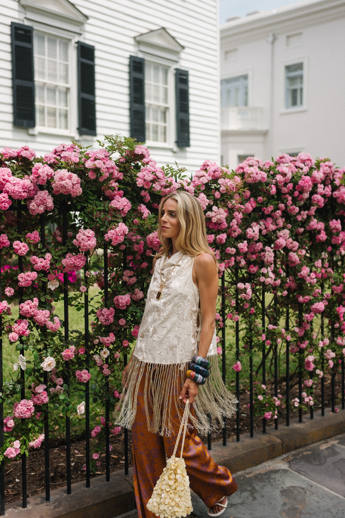 white silk fringe tank burnt orange silk pants sequin bag