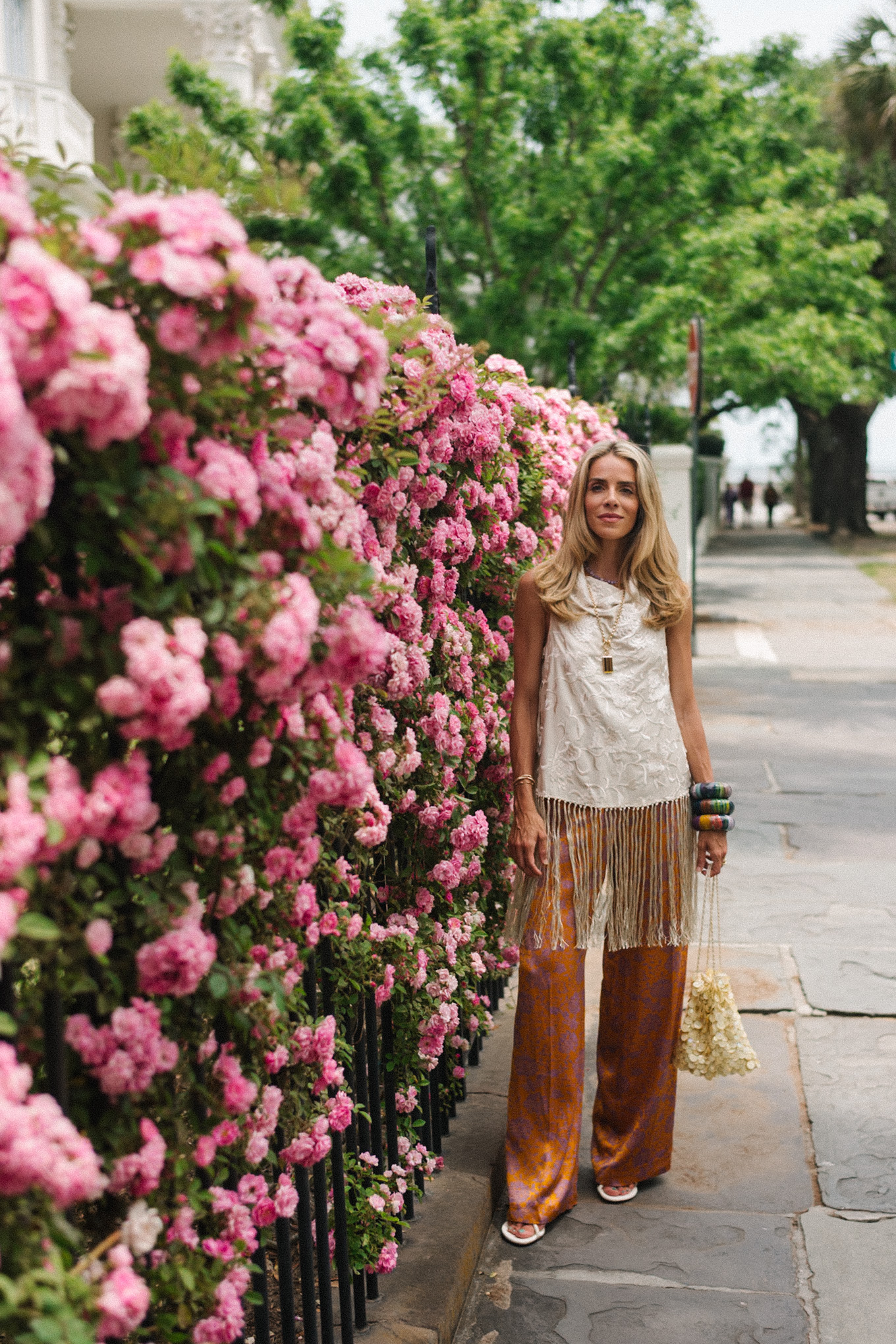 white silk fringe tank burnt orange silk pants sequin bag