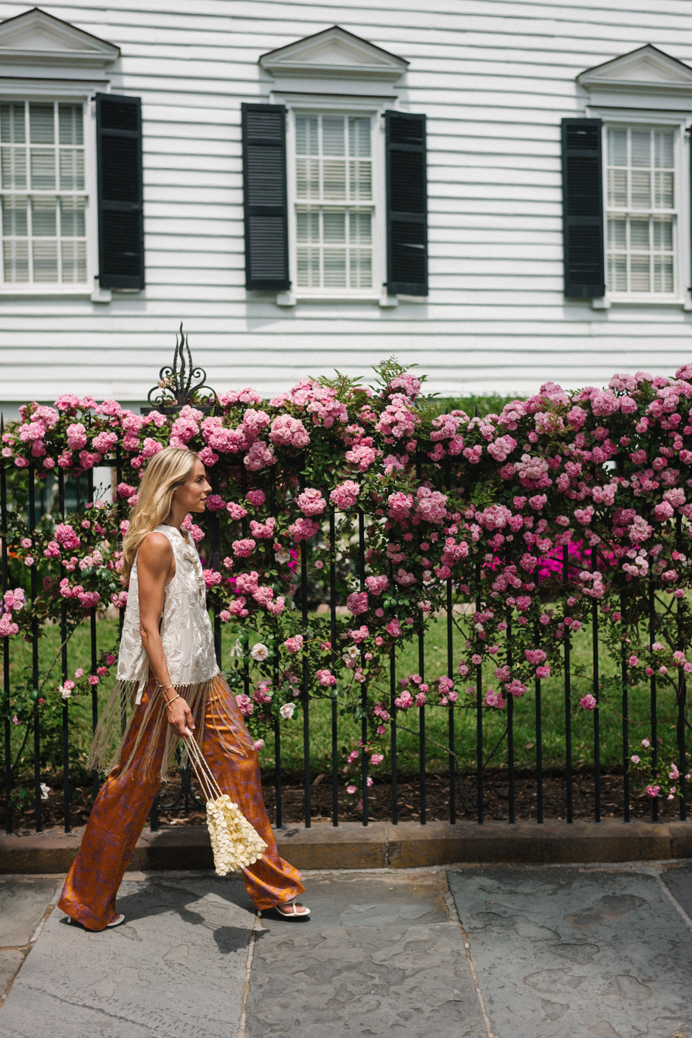 white silk fringe tank burnt orange silk pants sequin bag