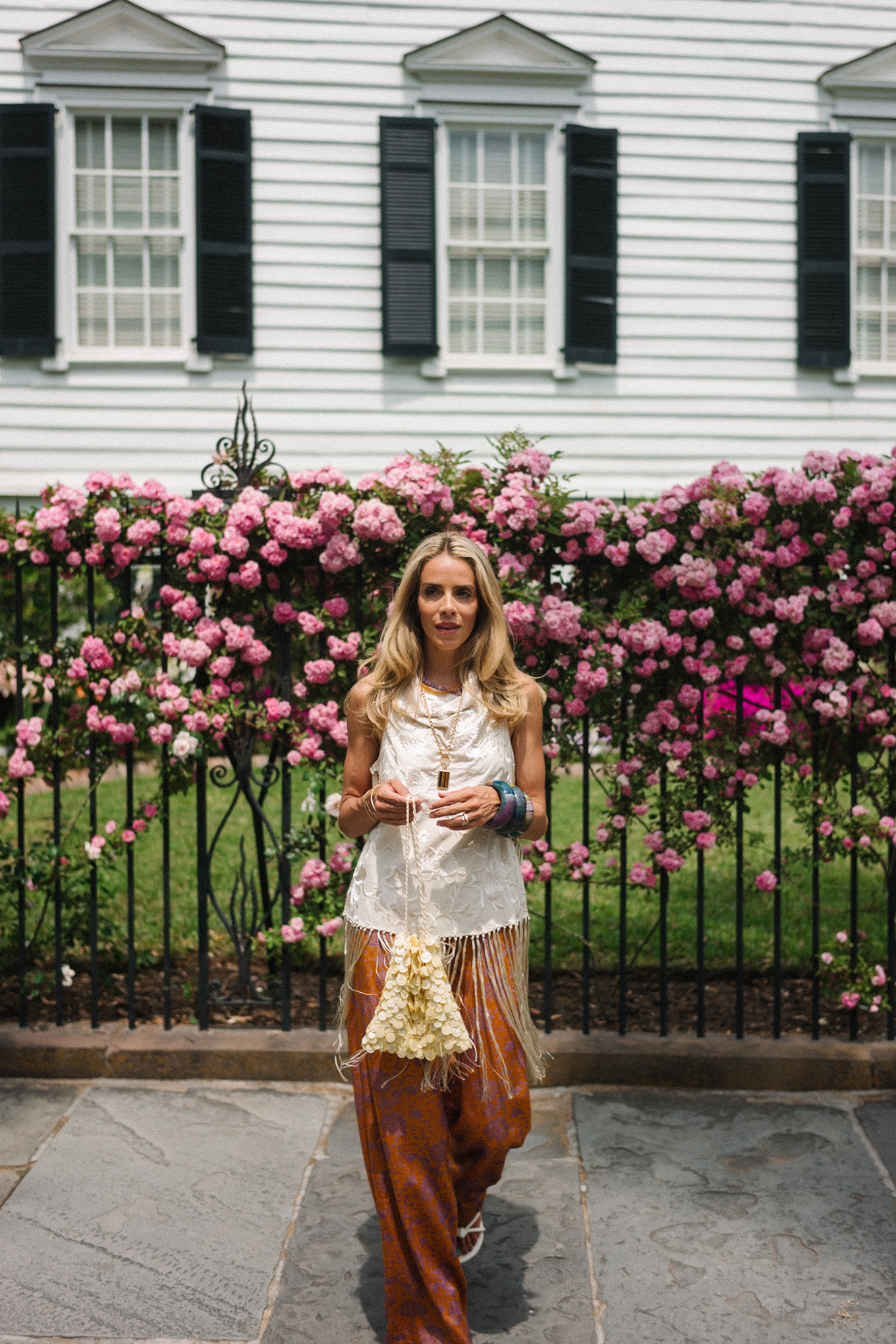 white silk fringe tank burnt orange silk pants sequin bag