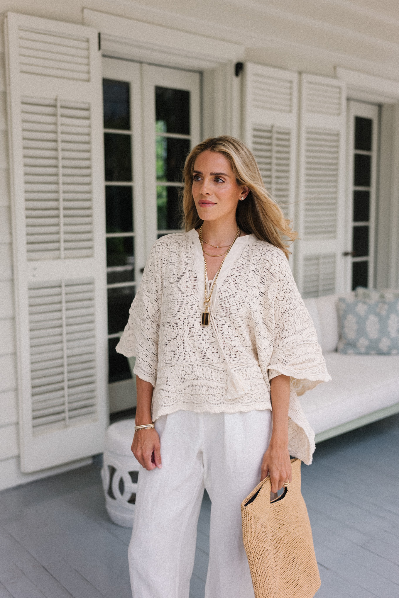 cream lace tunic blouse white linen pants rattan woven bag strappy sandals