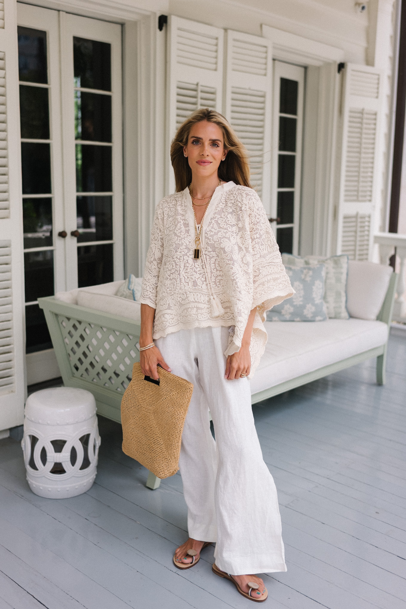 cream lace tunic blouse white linen pants rattan woven bag strappy sandals