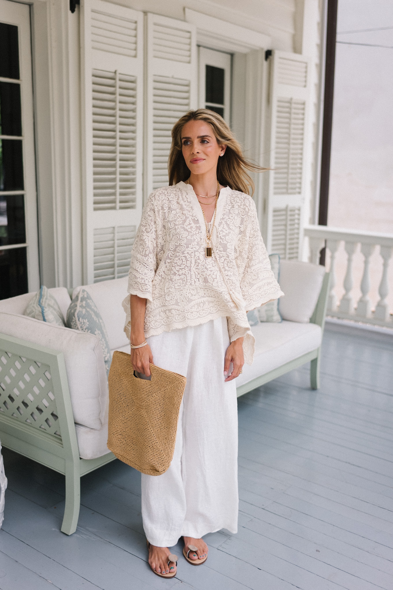 cream lace tunic blouse white linen pants rattan woven bag strappy sandals
