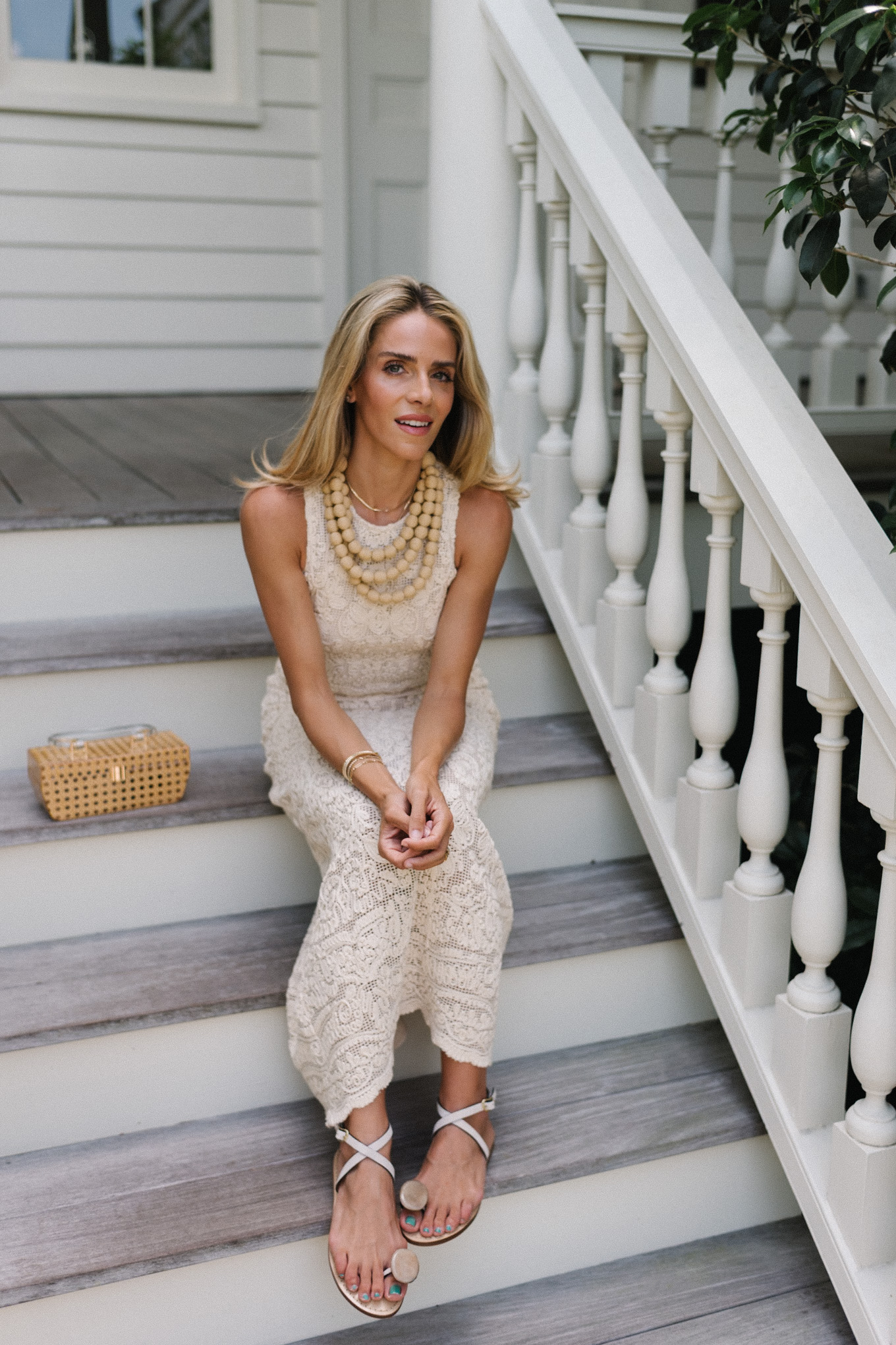 cream lace dress basket clutch rattan beaded necklace strappy sandals